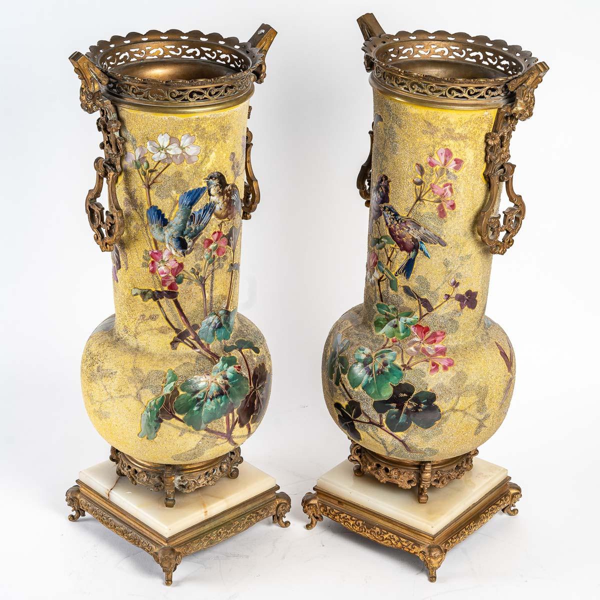 Pair of Enameled Porcelain, Gilt Bronze and Onyx Vases.

Pair of vases in the Théodore Deck taste in enameled porcelain, original gilt bronze mounting, onyx plaque on the base, late 19th century, Napoleon III period, large