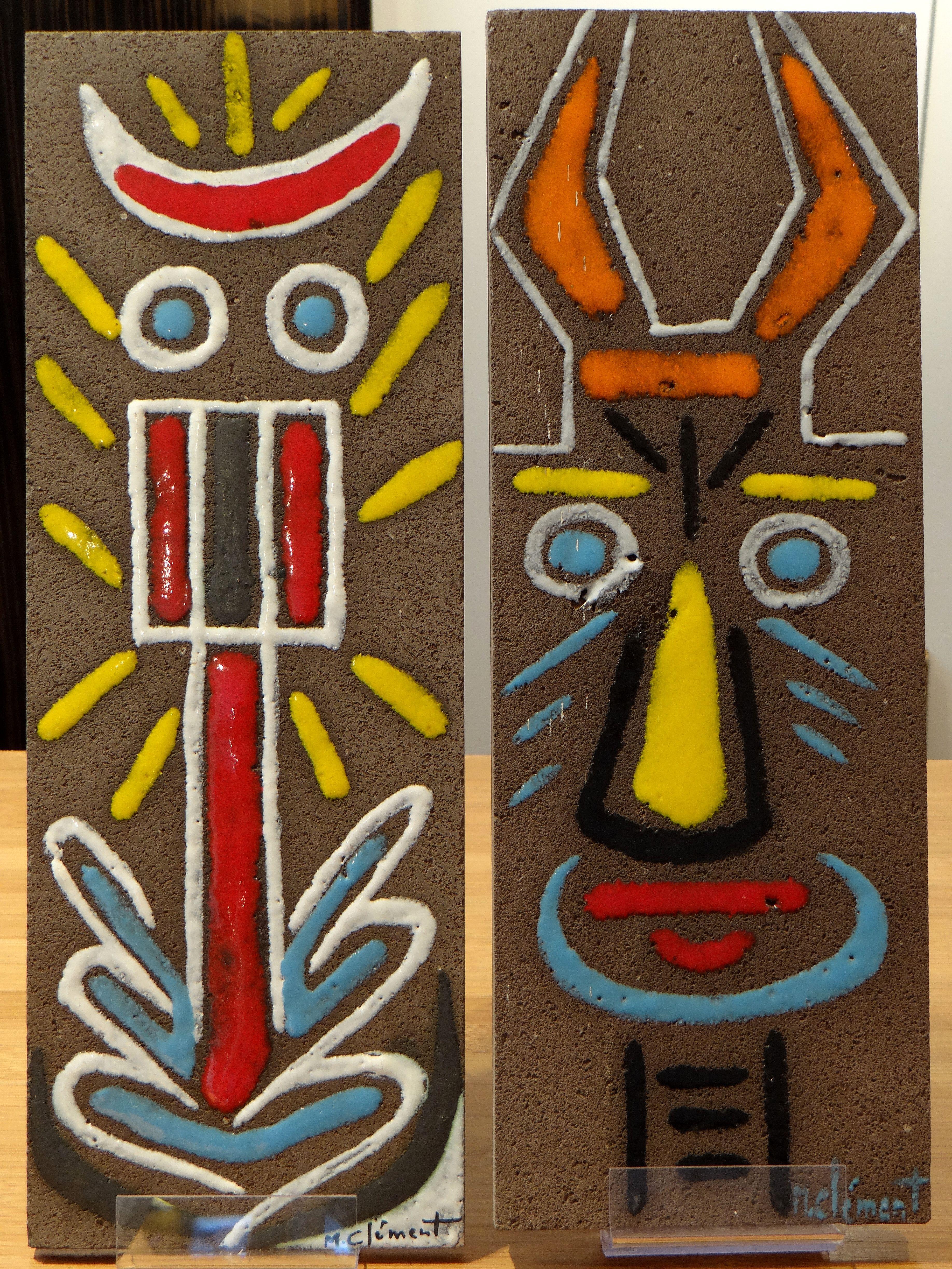 Very nice pair of enamelled ceramic panels (lava) 1950s-1960s appearing a very colorful character. Creation of Michel Clément, ceramist in the former commune of Croix-de-Vie, now Saint-Gilles Croix de Vie since 1967.
The decor, by its style and its