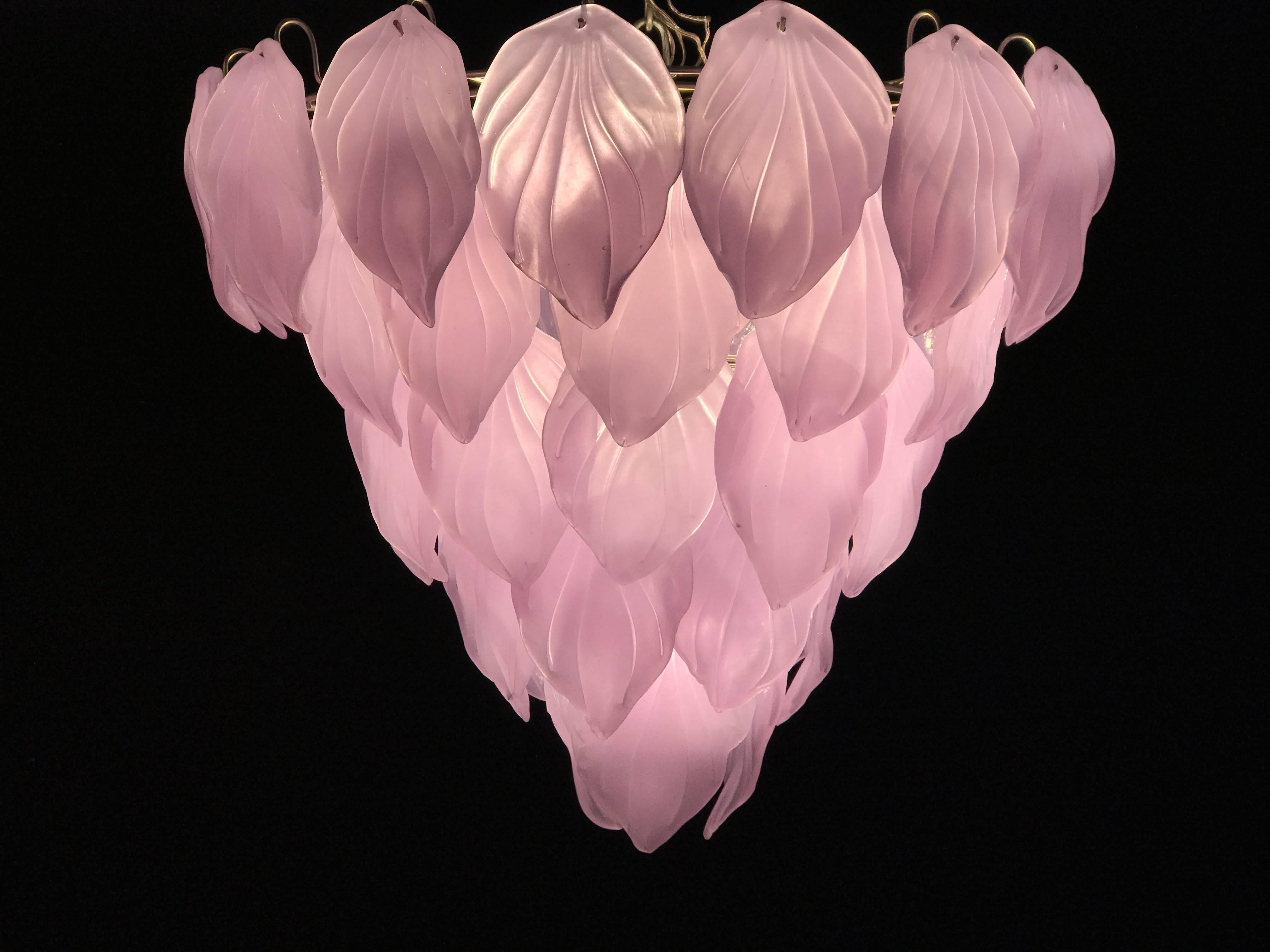 Magic transformation of the glasses color from violet to pink when the light is on.
Each with 50 precious Murano glass leaves on five levels. Available also a pair of sconces.
Measures: Height without chain 65 cm (26 inches).
16 E 14 light bulbs.