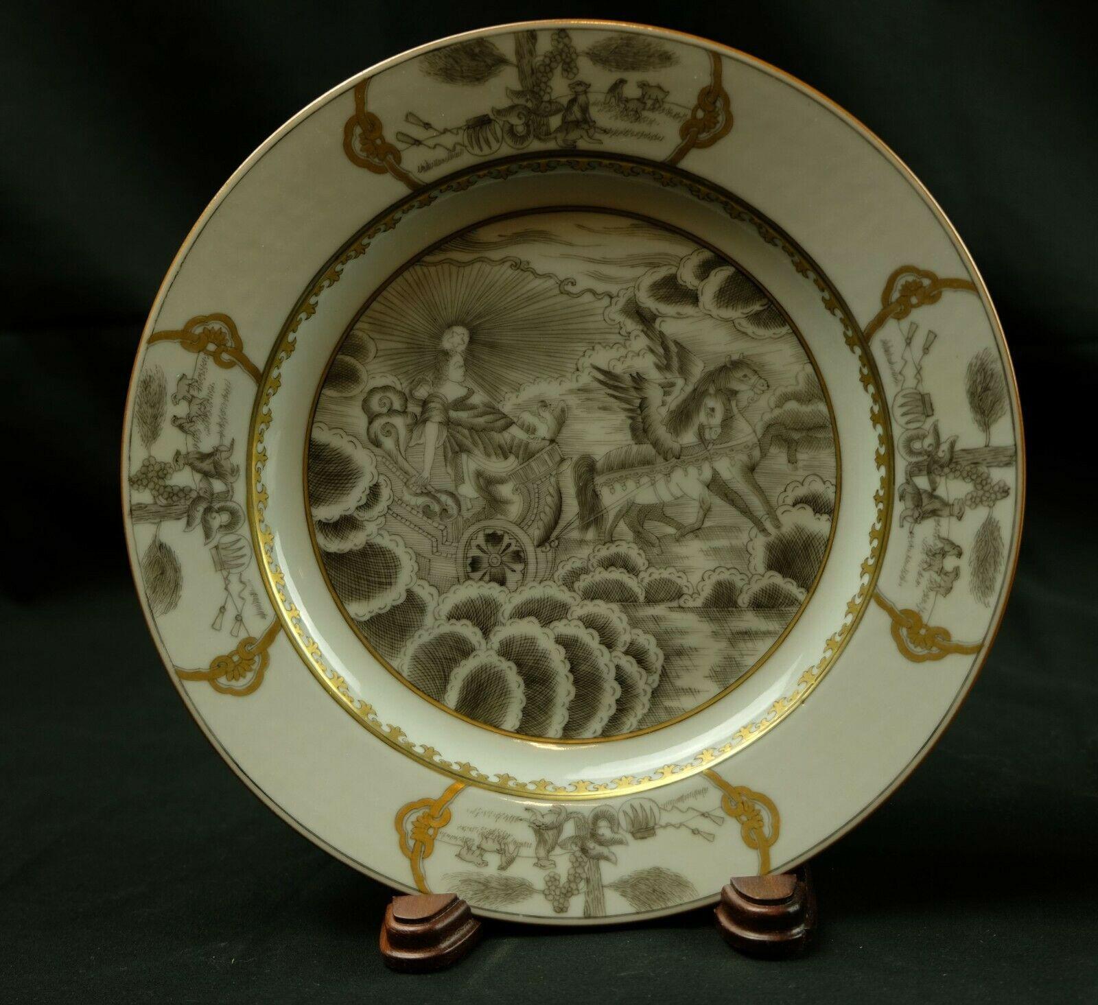 The plates are decorated with ink-black enamel of an angel riding in a carriage in the clouds. Gilt on the mouth rim.


  
