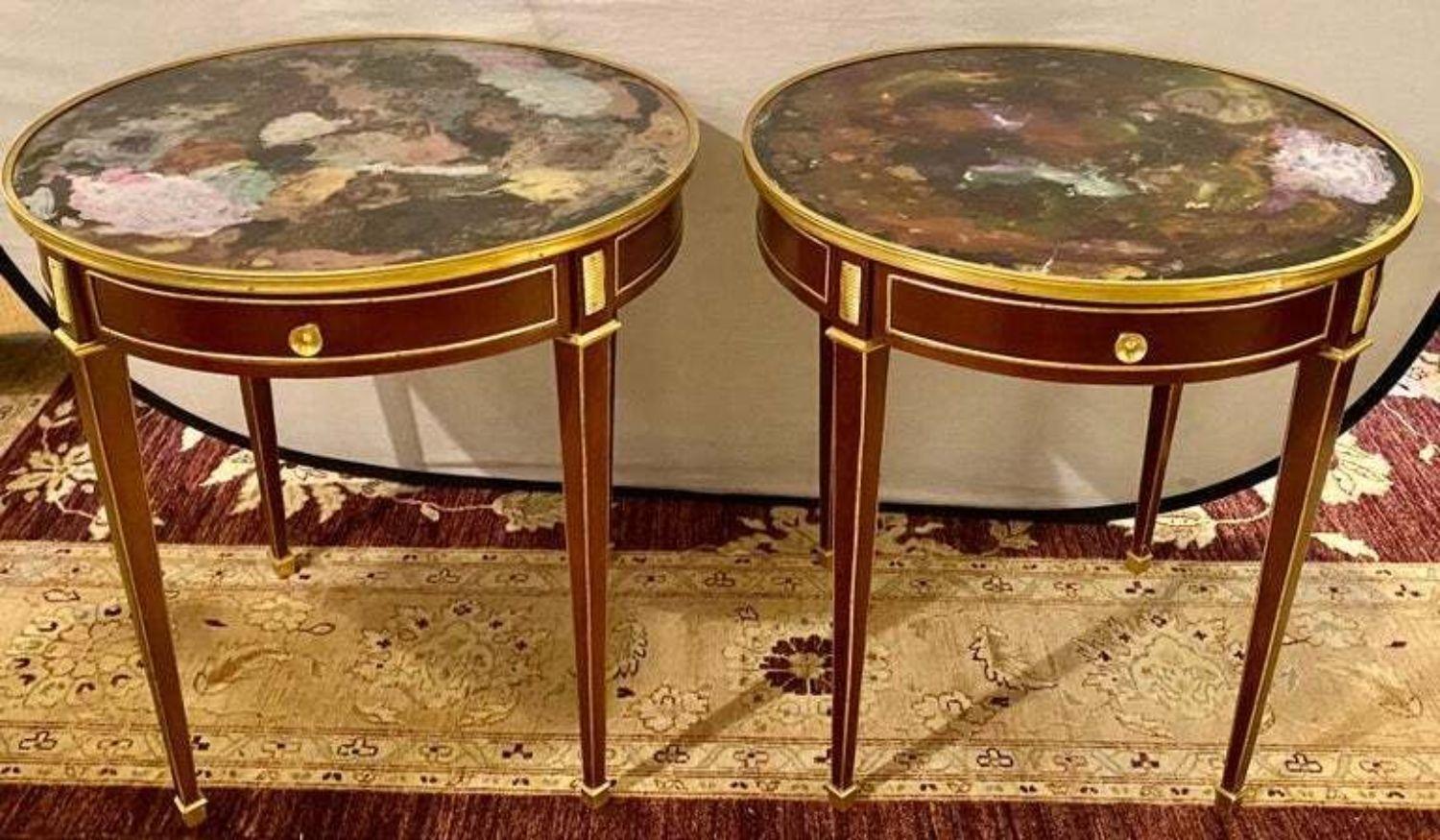 Pair of end, center or sofa tables bronze mounted single drawer multi-color glass tops in the manner of Maison Jansen. These finely crafted mahogany end table have tapering brass framed sleek legs supporting a bronze galleried multi colored glass