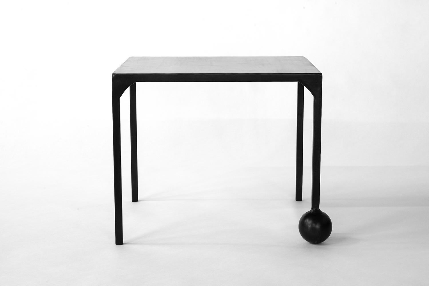 TABLE NO. 2 - SET
J.M. Szymanski
d. 2017

This geometric, solid, steel structure is supported by a cast-sphere base. The refined simplicity of this design speaks volumes, and adds depth and elegance to any space. 

Custom sizes available. Made in