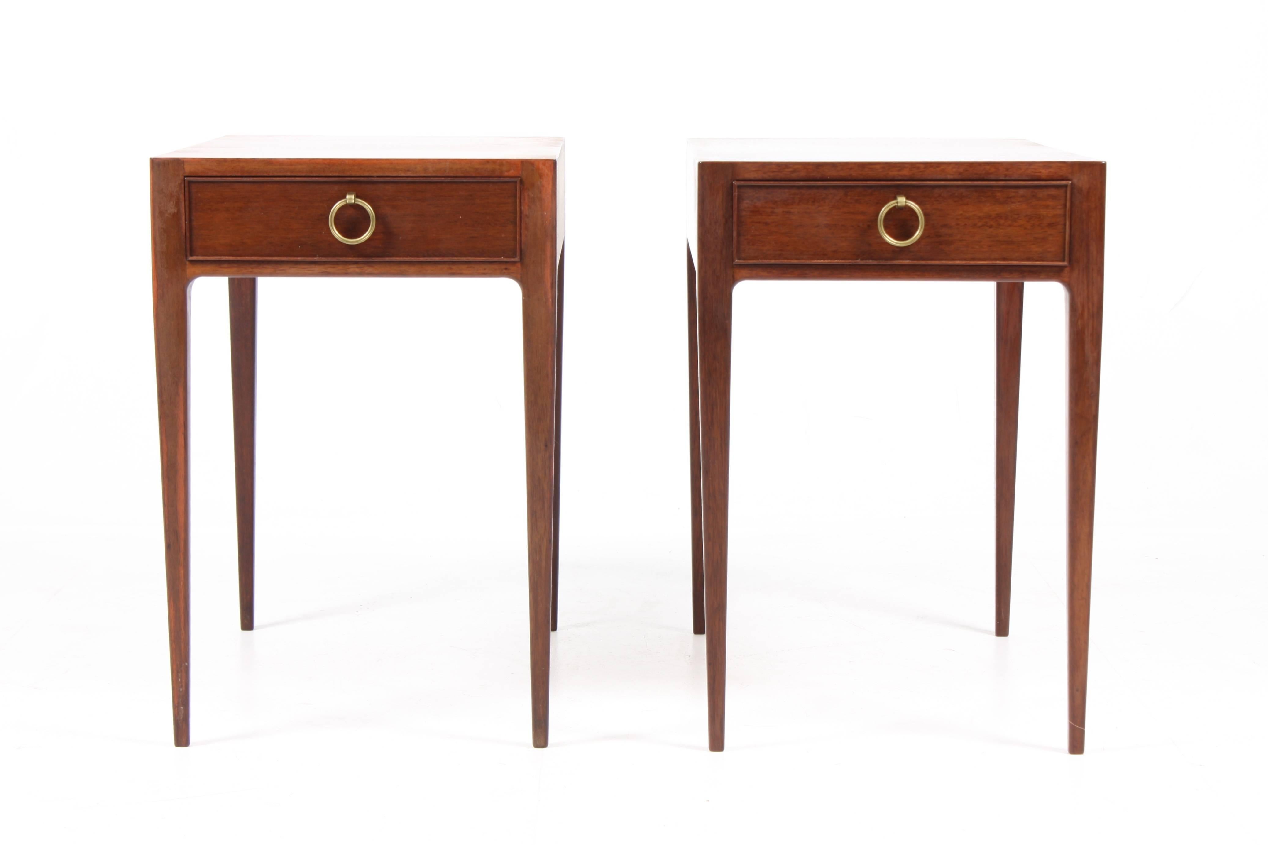 Pair of 1940s Scandinavian end tables designed by Danish Architect Ernst Kühn for Lysberg Hansen. Made of mahogany with hard ware in brass. The perfect choice for a sofa or as night stands. Great condition.