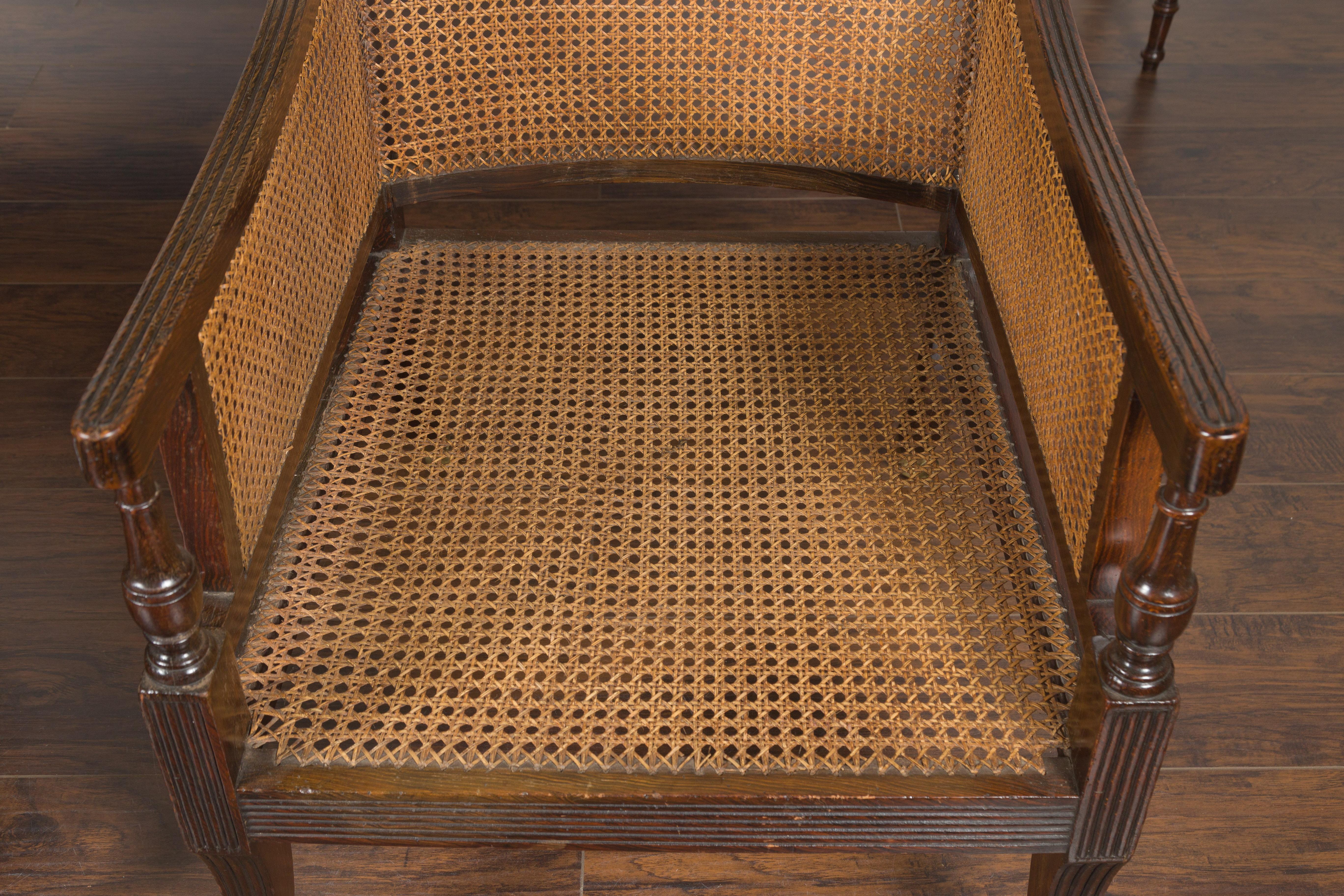 Pair of English 1870s Cane and Oak Library Chairs with Cushions and Casters 3