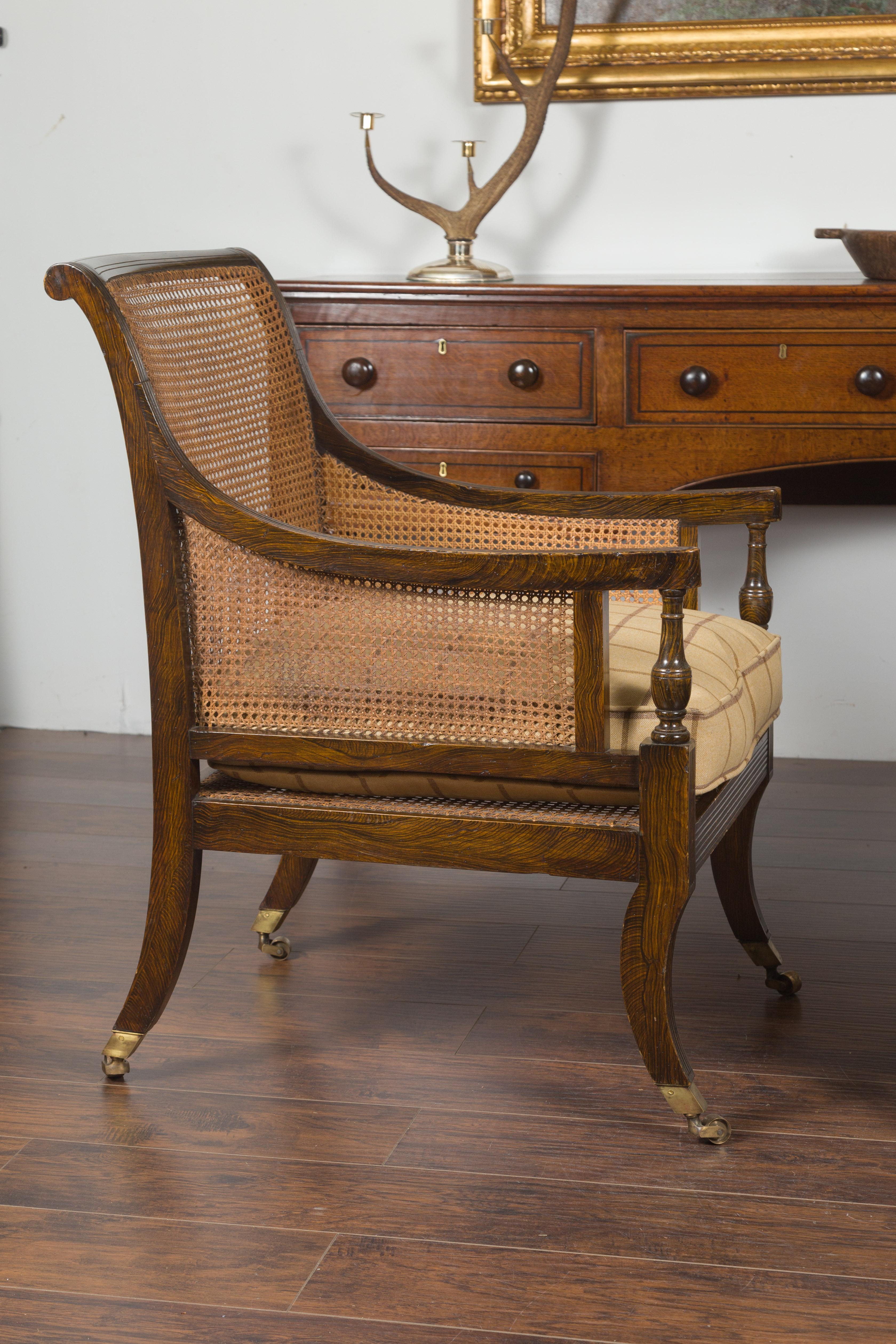 Pair of English 1870s Cane and Oak Library Chairs with Cushions and Casters 7