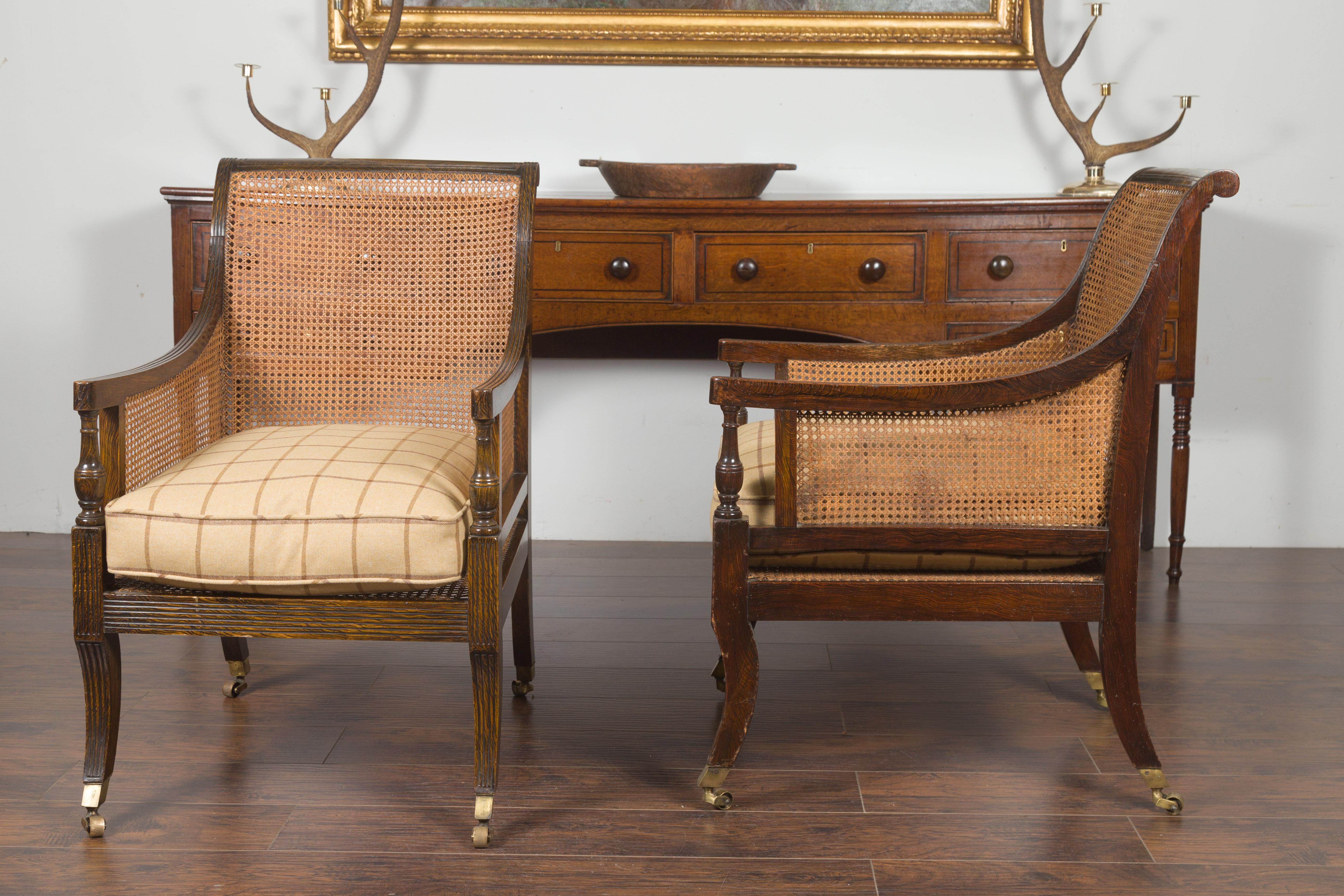 Pair of English 1870s Cane and Oak Library Chairs with Cushions and Casters 8
