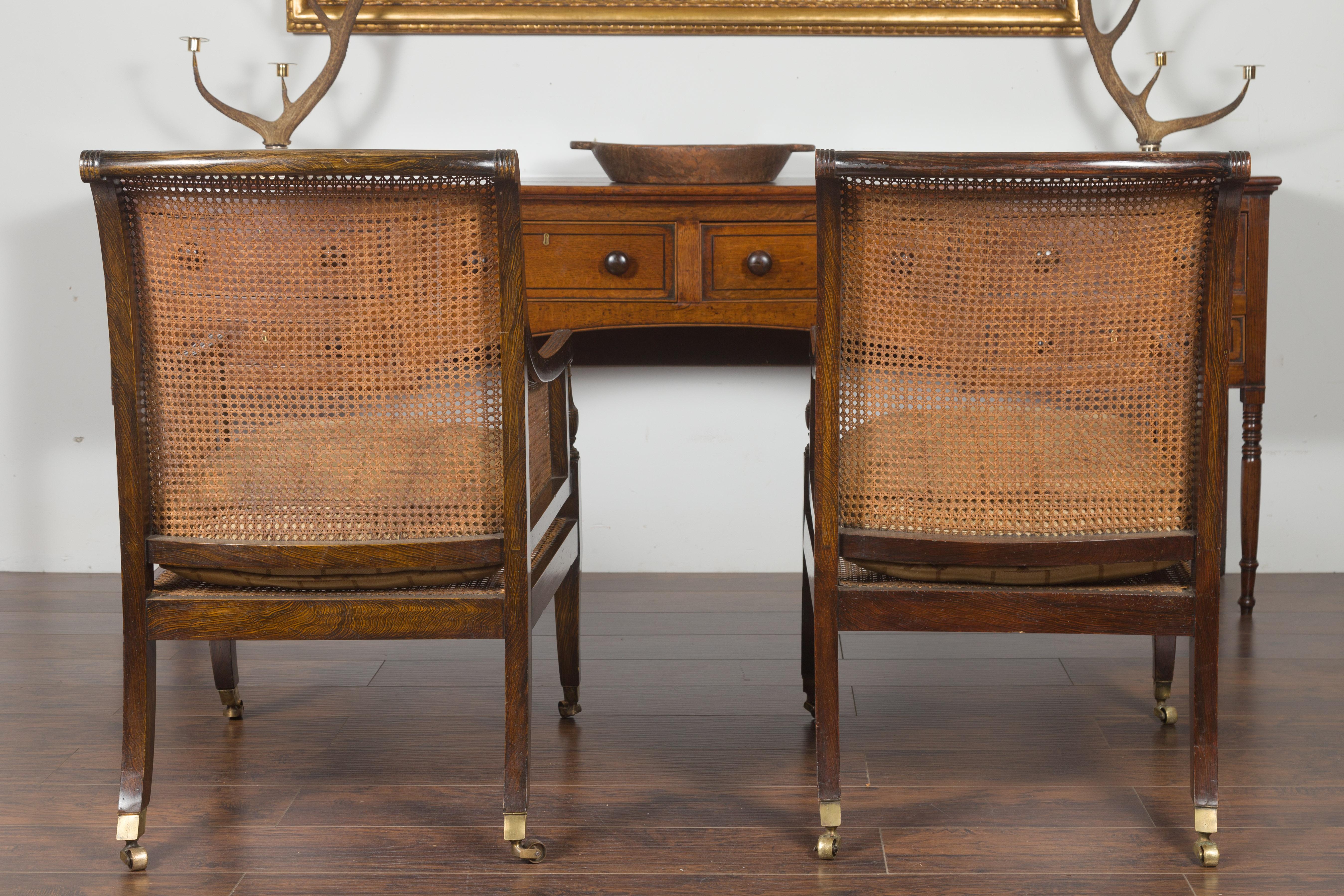 Pair of English 1870s Cane and Oak Library Chairs with Cushions and Casters 10