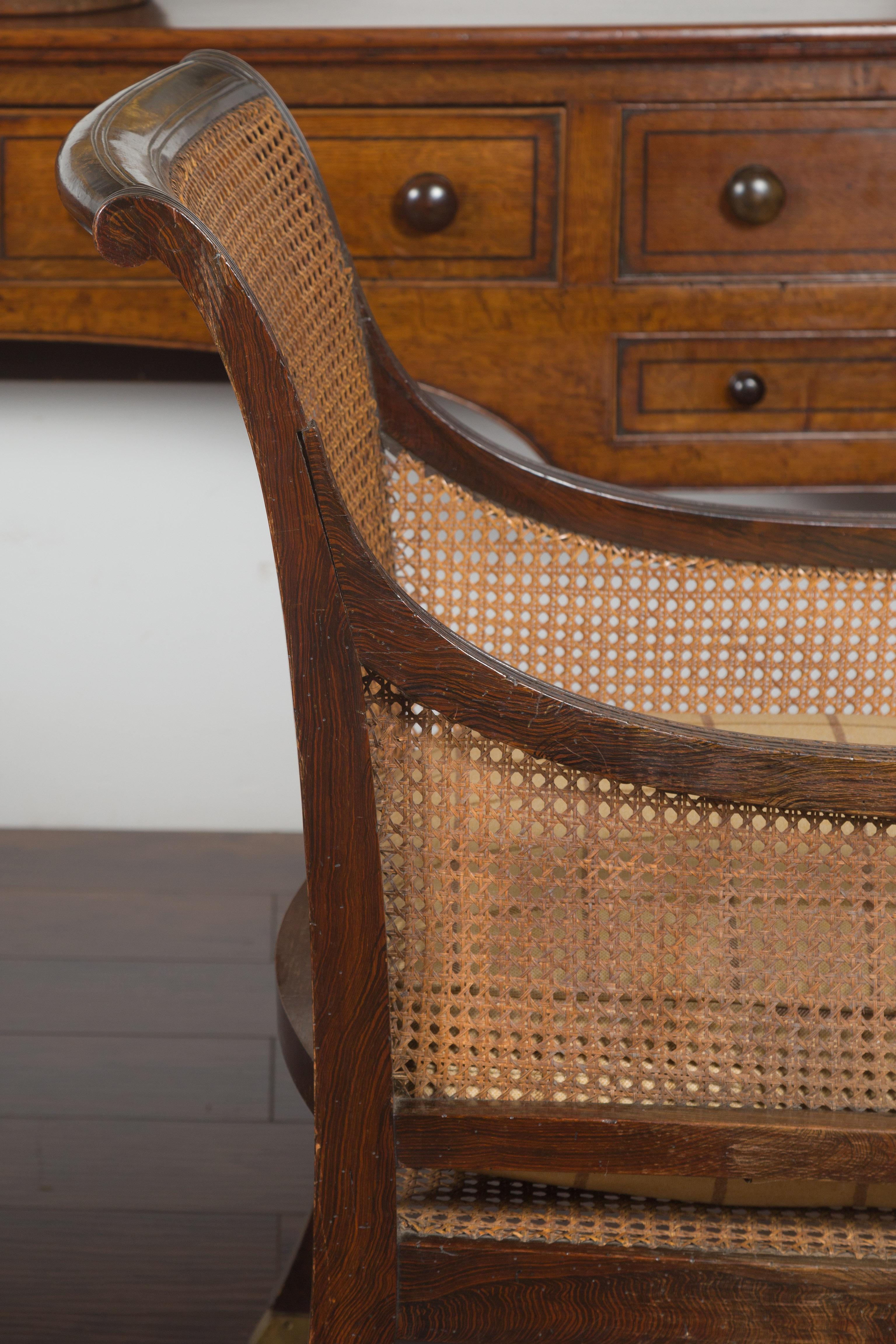 Pair of English 1870s Cane and Oak Library Chairs with Cushions and Casters 11