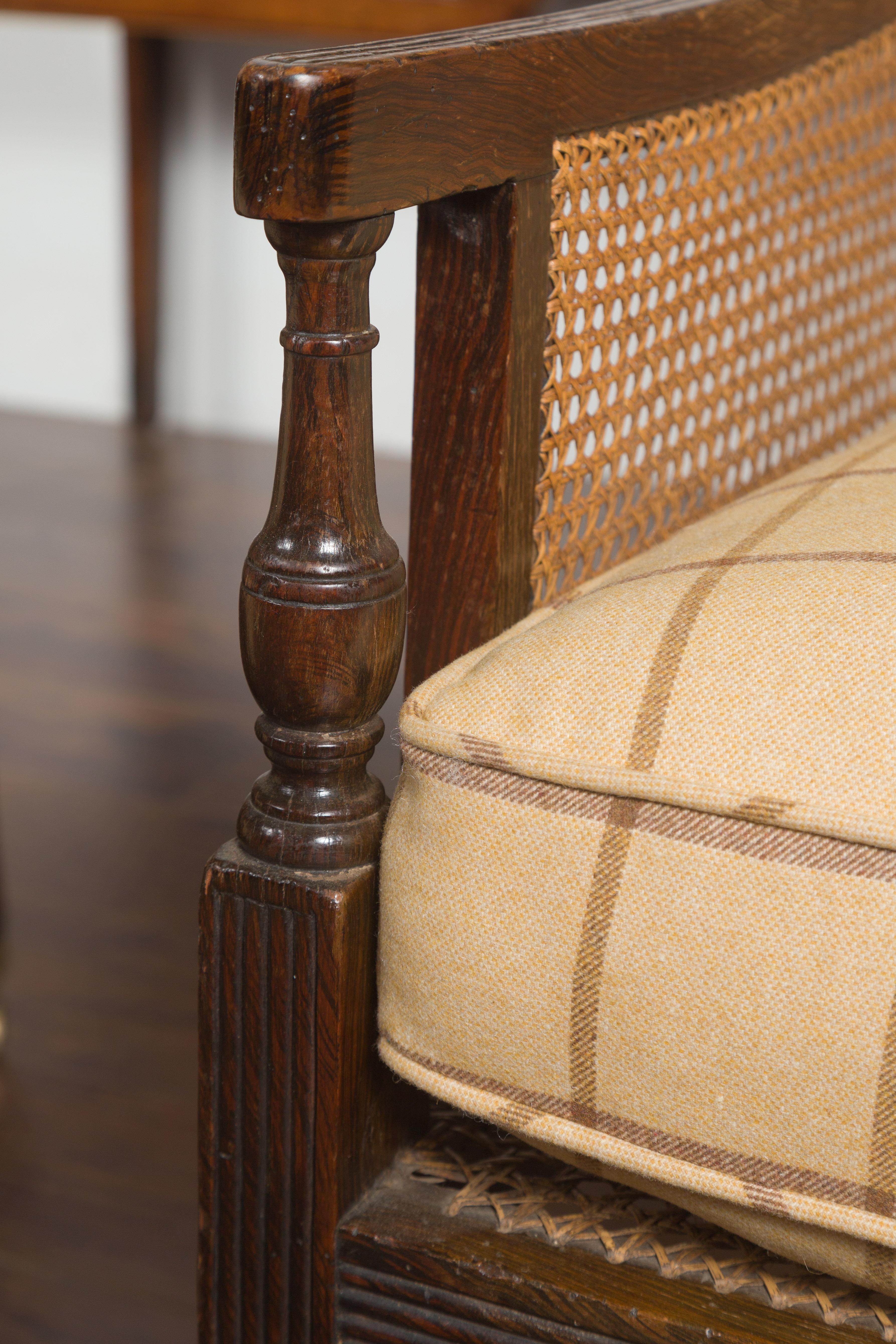 Pair of English 1870s Cane and Oak Library Chairs with Cushions and Casters In Good Condition In Atlanta, GA