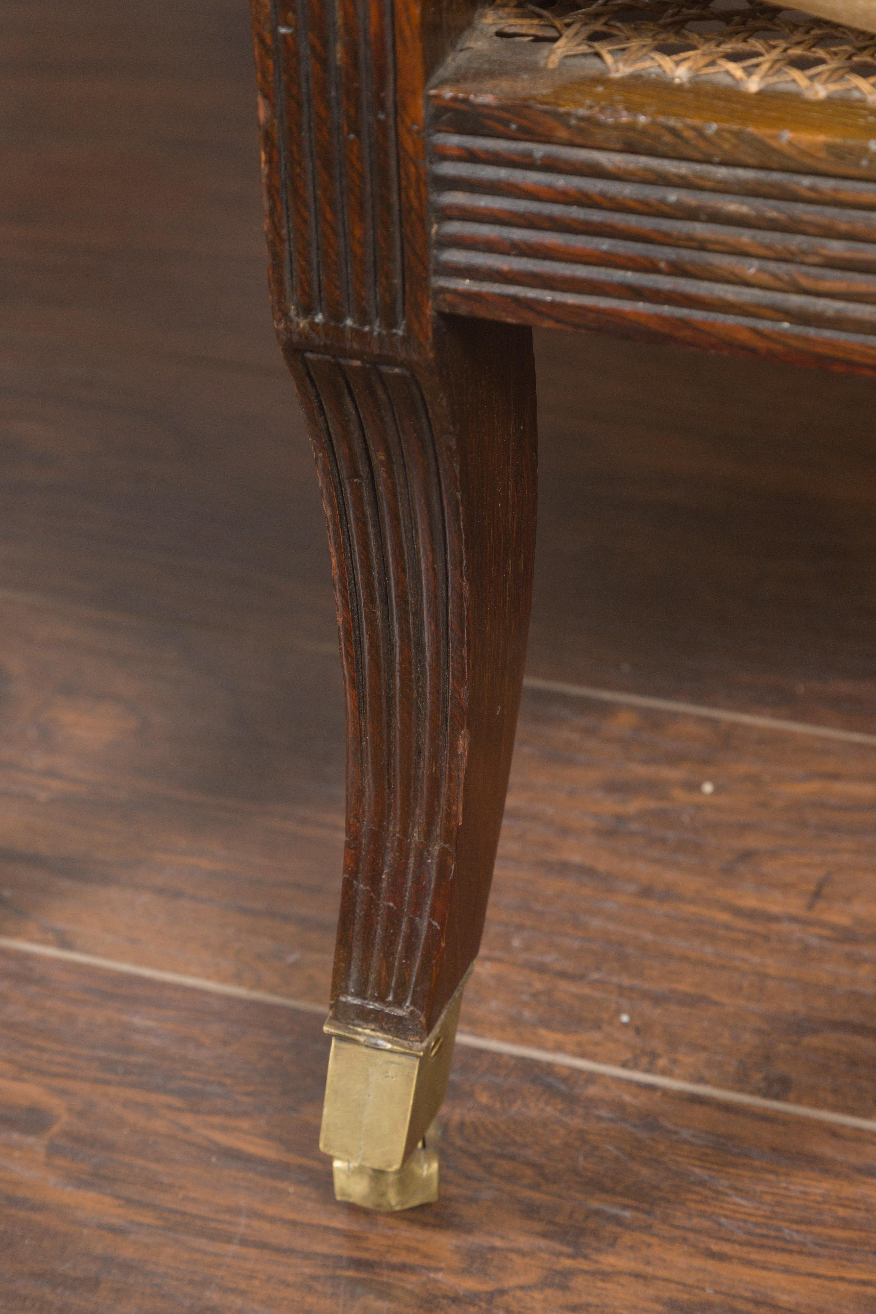 Upholstery Pair of English 1870s Cane and Oak Library Chairs with Cushions and Casters