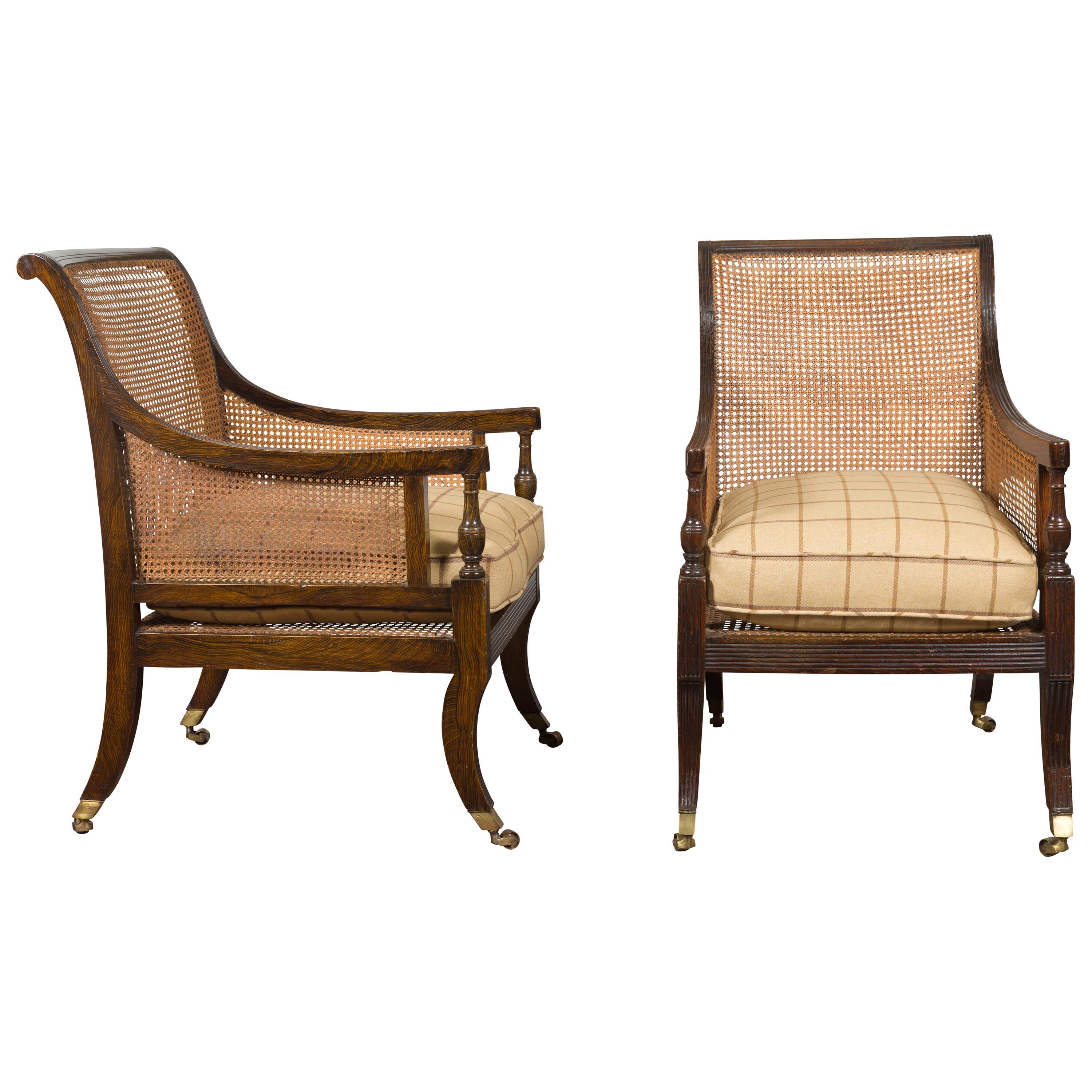 Pair of English 1870s Cane and Oak Library Chairs with Cushions and Casters