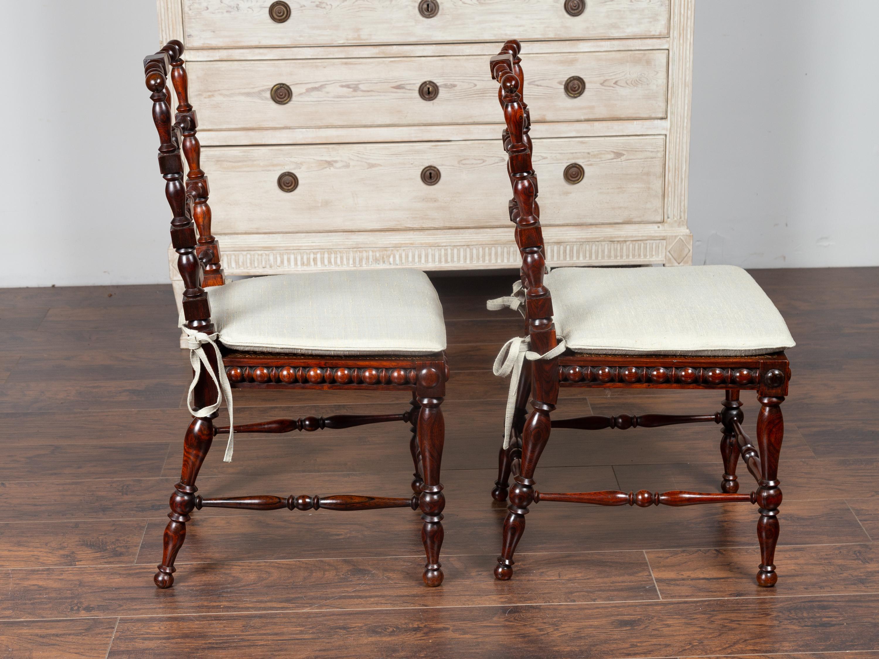 Pair of English 1870s Rosewood Side Chairs with Cane Seats and Turned Spindles 1