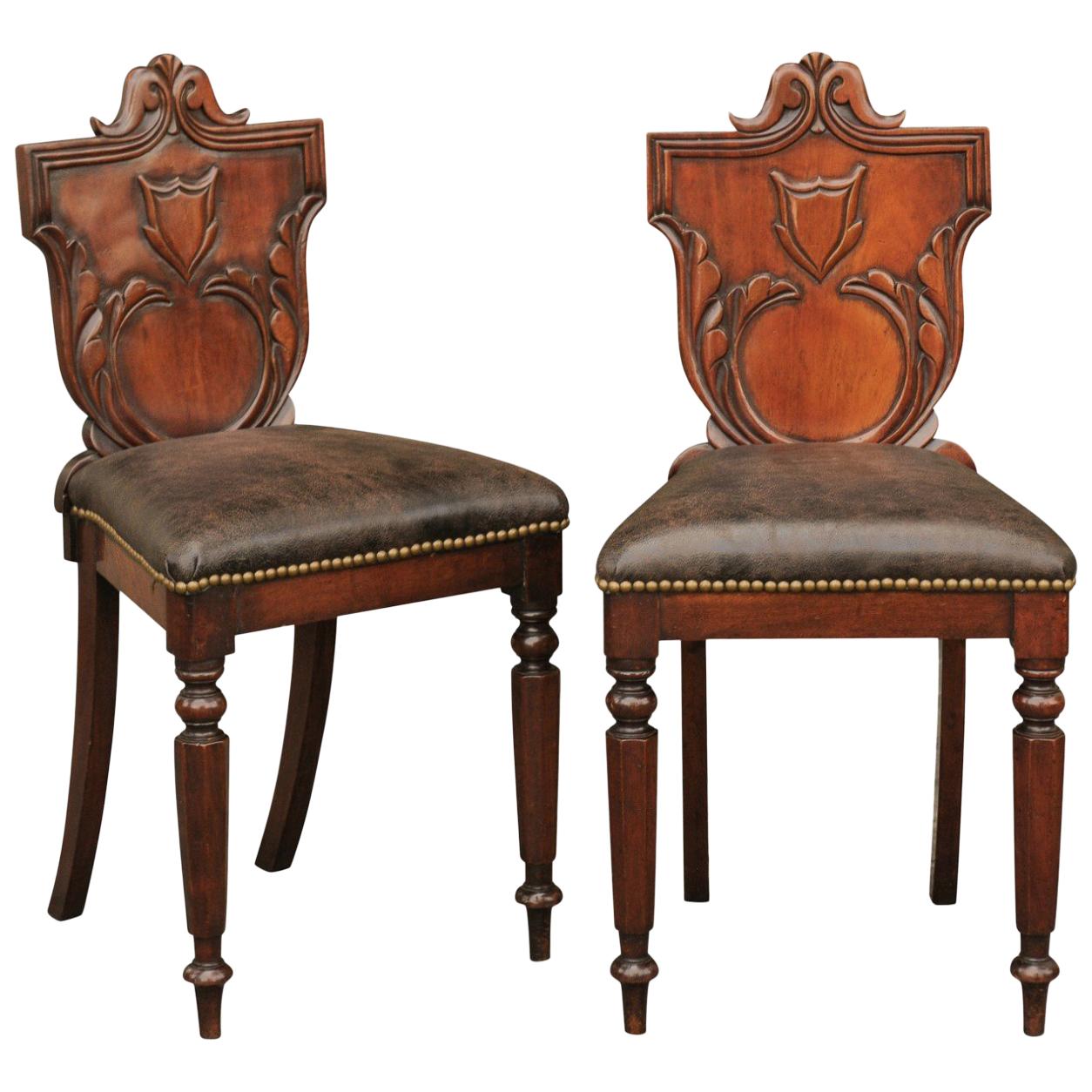 Pair of English 1880s Carved Oak Hall Chairs with Leather Upholstered Seats