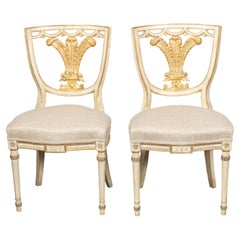 Pair of English 1900s Neoclassical Style Painted and Gilt Chairs with Feathers