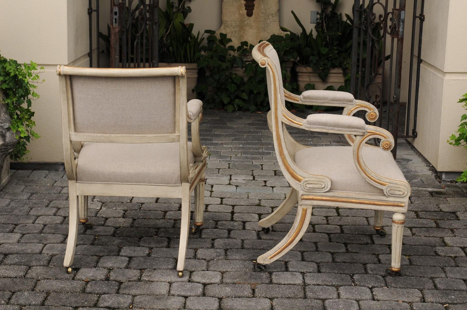 Wood Pair of English 1900s Regency Style Painted and Parcel-Gilt Armchairs on Casters