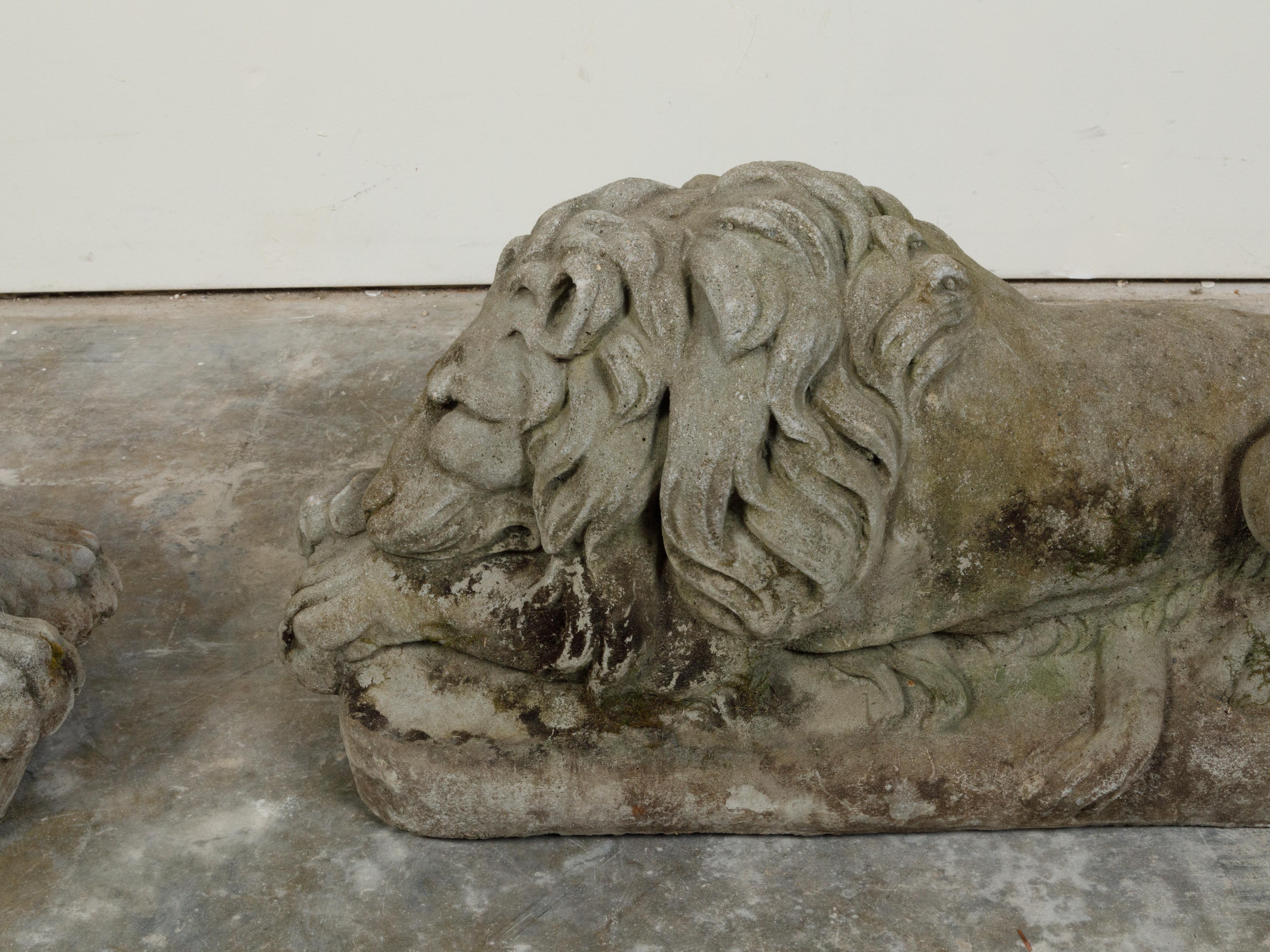 Pair of English 1920s Cast Stone Reclining Lion Sculptures on Conforming Bases For Sale 3