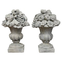Antique Pair of English 1920s Cast Stone Urns Ornaments with Fruit and Floral Motifs