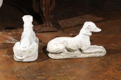 Pair of English 19th Century Carved Stone Reclining Dogs with Weathered Patina