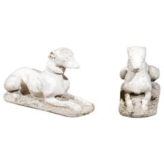 Pair of English 19th Century Carved Stone Reclining Dogs with Weathered Patina