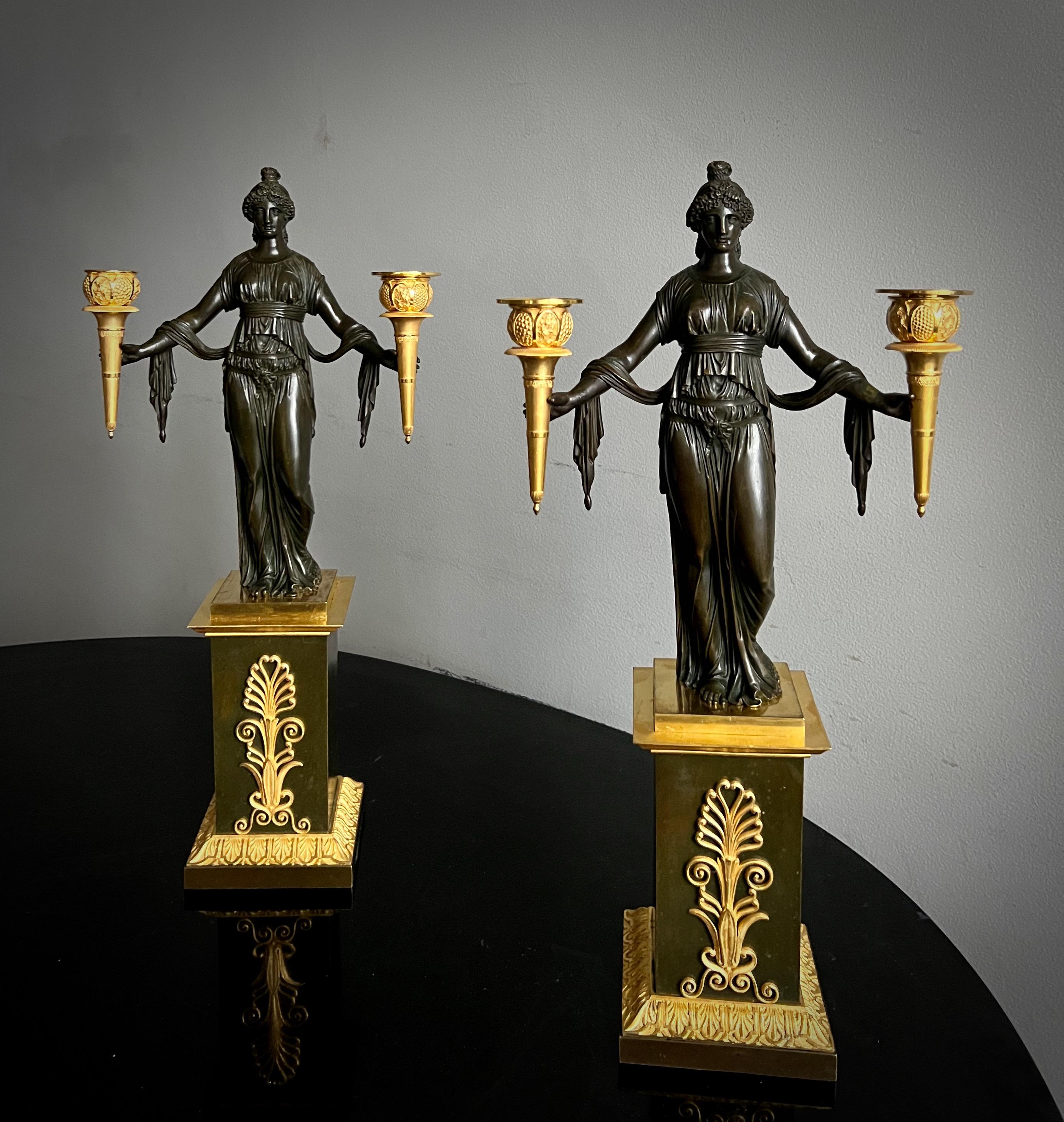 A very elegant and fine pair of gilt and patinated empire candelabra of superb quality. Possibly made in England and from the Vulliamy workshops. Under the base possibly dated 1811. Gilding is in very good condition and the chasing of the bronze is