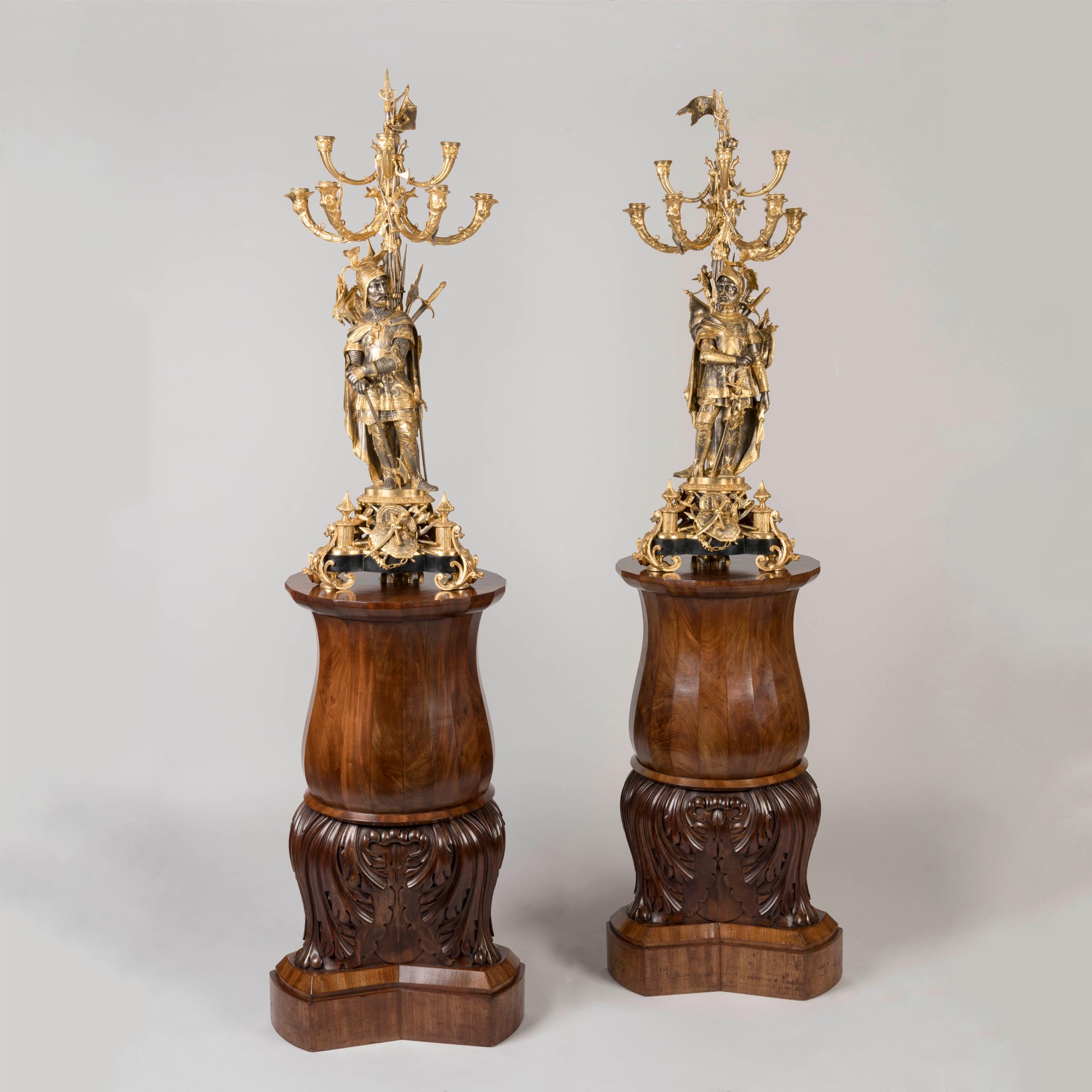 A Pair of Mid-19th Century Carved Baluster Pedestals

Carved from mahogany, each bulbous baluster pedestal rising from a stepped plinth  supporting the oversized acanthus base beneath the waisted multi-faceted mahogany body.
Circa 1845

Great as