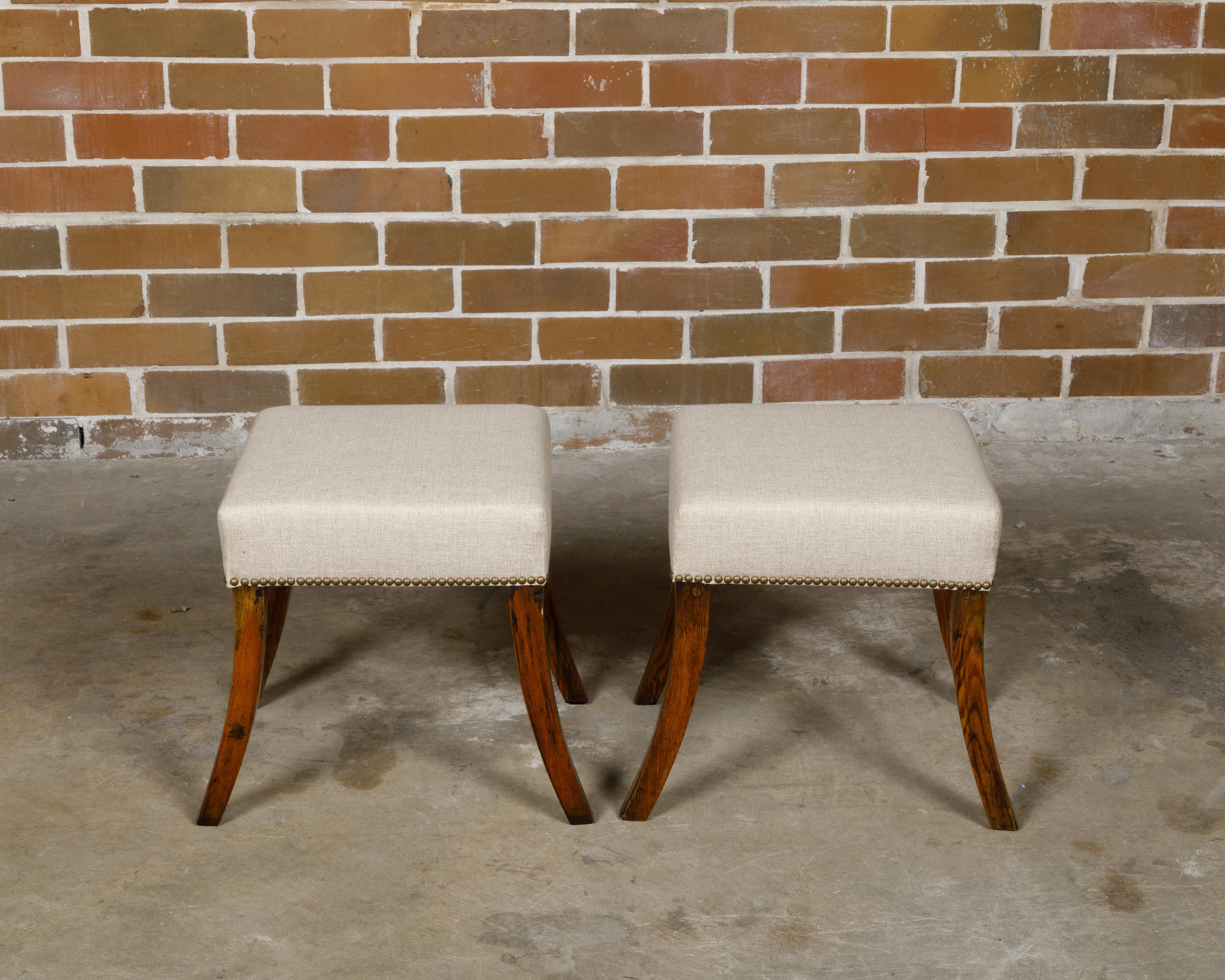 Pair of English 19th Century Oak Stools with Saber Legs and Custom Upholstery In Good Condition For Sale In Atlanta, GA
