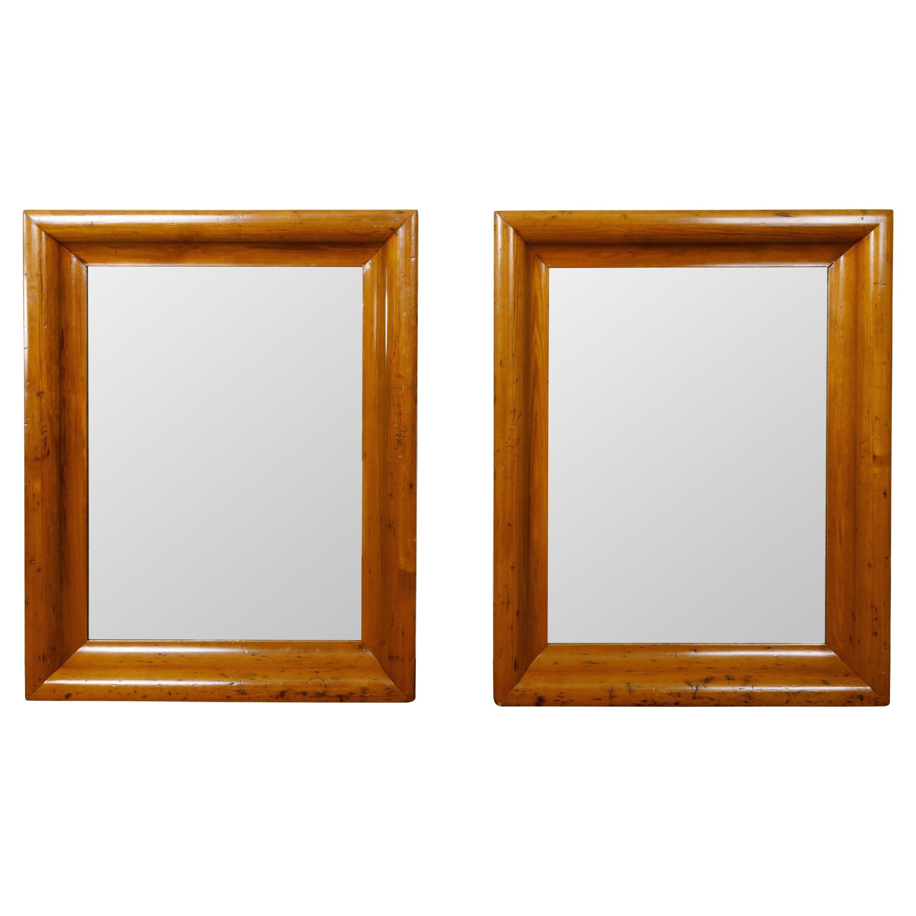 Pair of English 19th Century Pine Wall Mirrors with Beveled Curving Frames