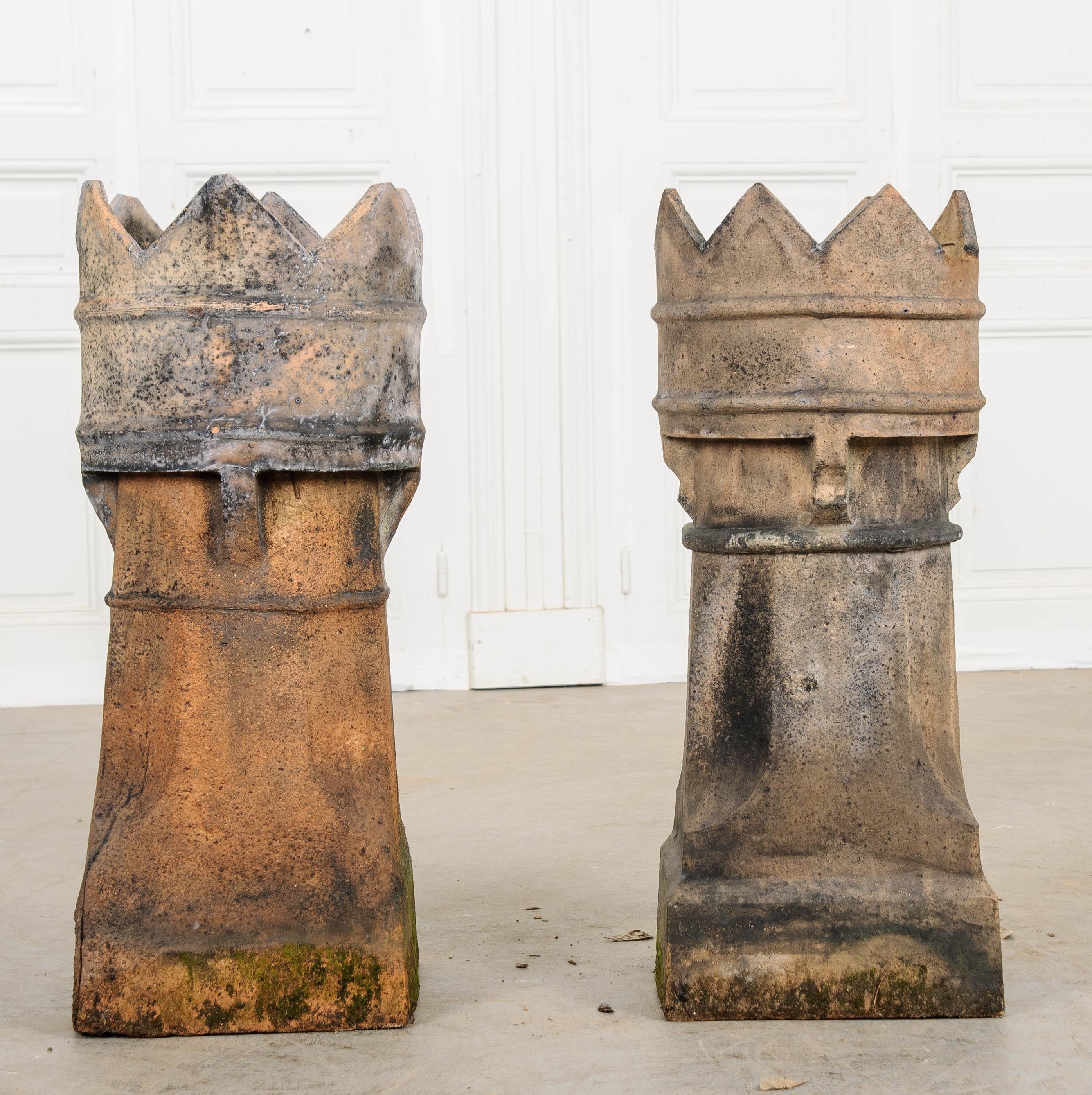 A remarkable pair of Victorian-era English terracotta chimney pots. These antique architectural elements serve as both decorative and functional additions to traditional chimney flues. During the 1800s, coal was used more and more to heat homes,