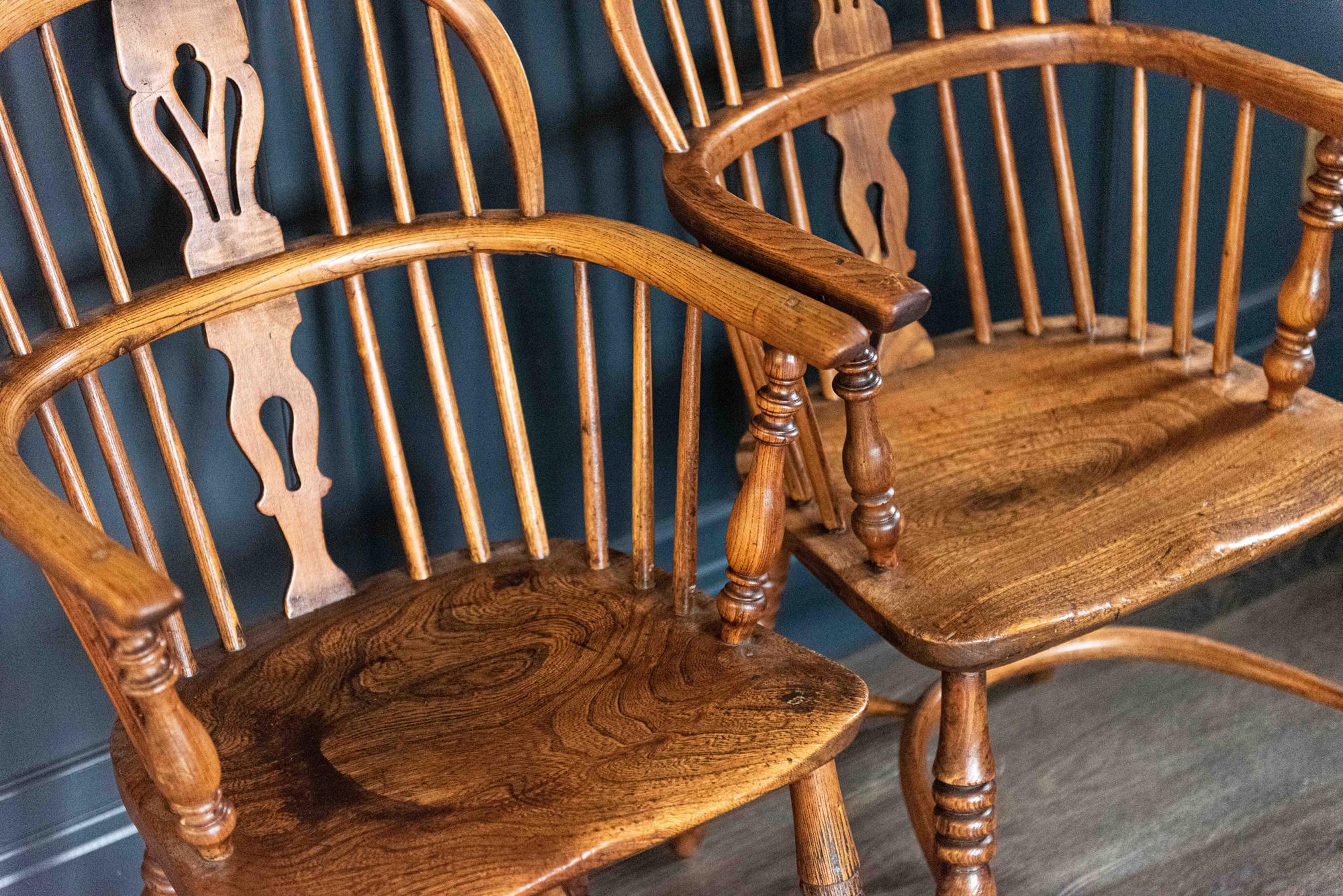 Pair of English 19th century Windsor chairs with open fret splats with turned supports and legs with crinoline stretchers.
Ash with elm seats, lovely wear, color and patina, circa 1835.

Price is for the pair

Measures: H 91 x 47.5 W x D 50 S/H