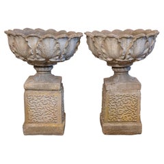 Pair of English 20th Century Stone Urns on Pedestals with Acanthus Leaf Motifs