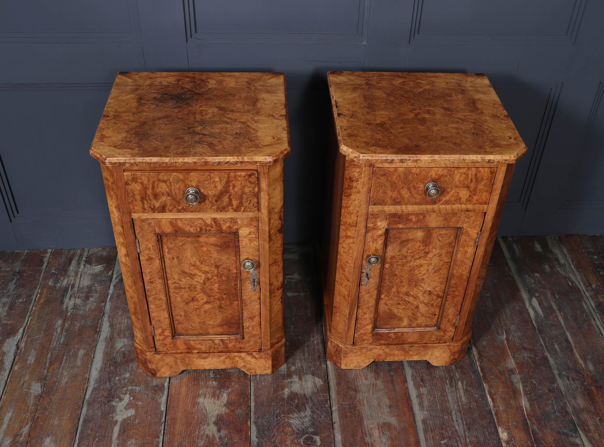 Antique Bedside Cabinets 
These quality pair of late 19th century bedside cabinets, crafted in England around 1880. Each cabinet has exceptional blonde colour and intricate grain patterns that highlight the artistry of the period. The elegant brass