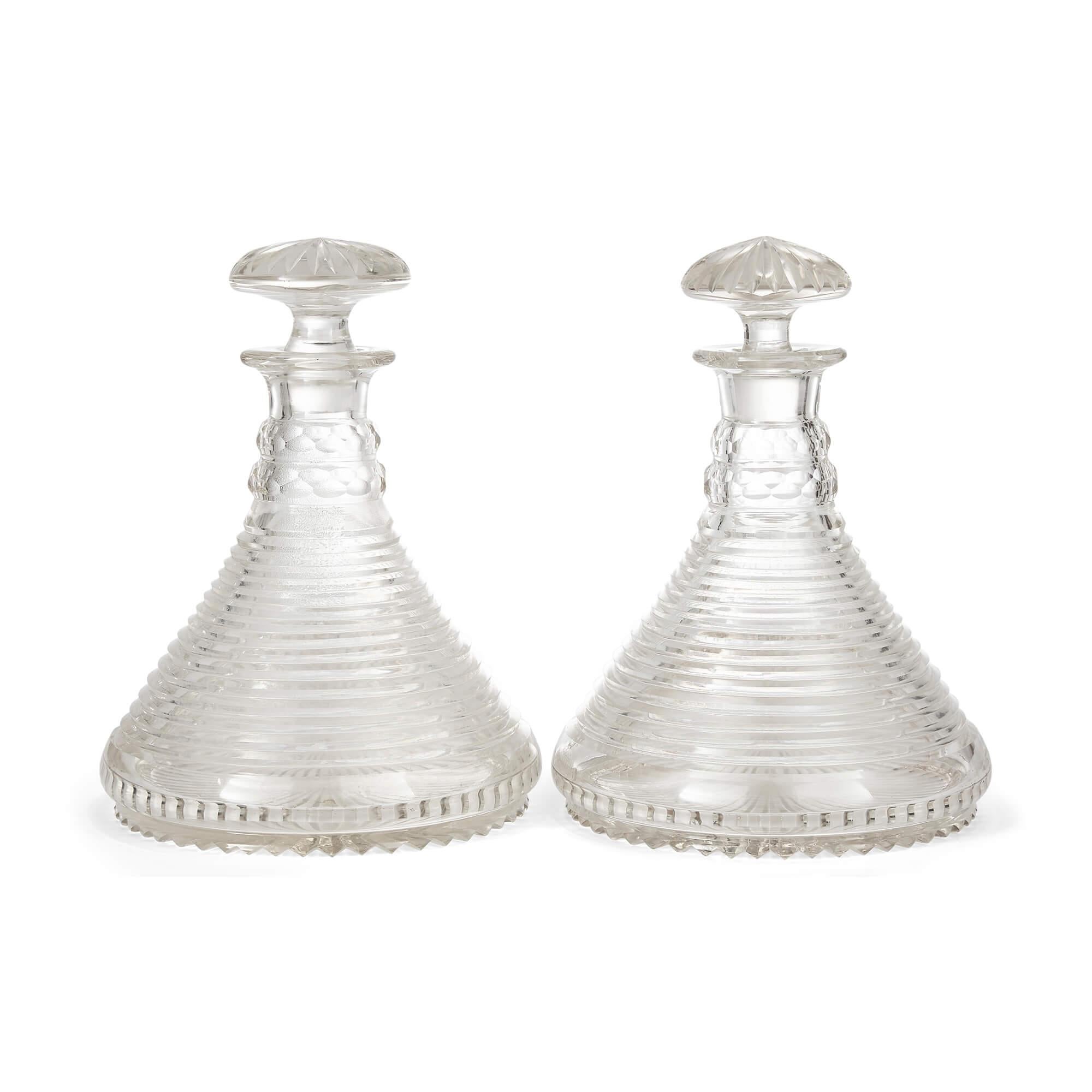 Pair of English antique glass ship decanters with stoppers.
English, Early 20th Century
Measures: Height 24cm, diameter 18cm

A pair of very Fine English antique glass ship decanters, these pieces were made in England in the early part of the