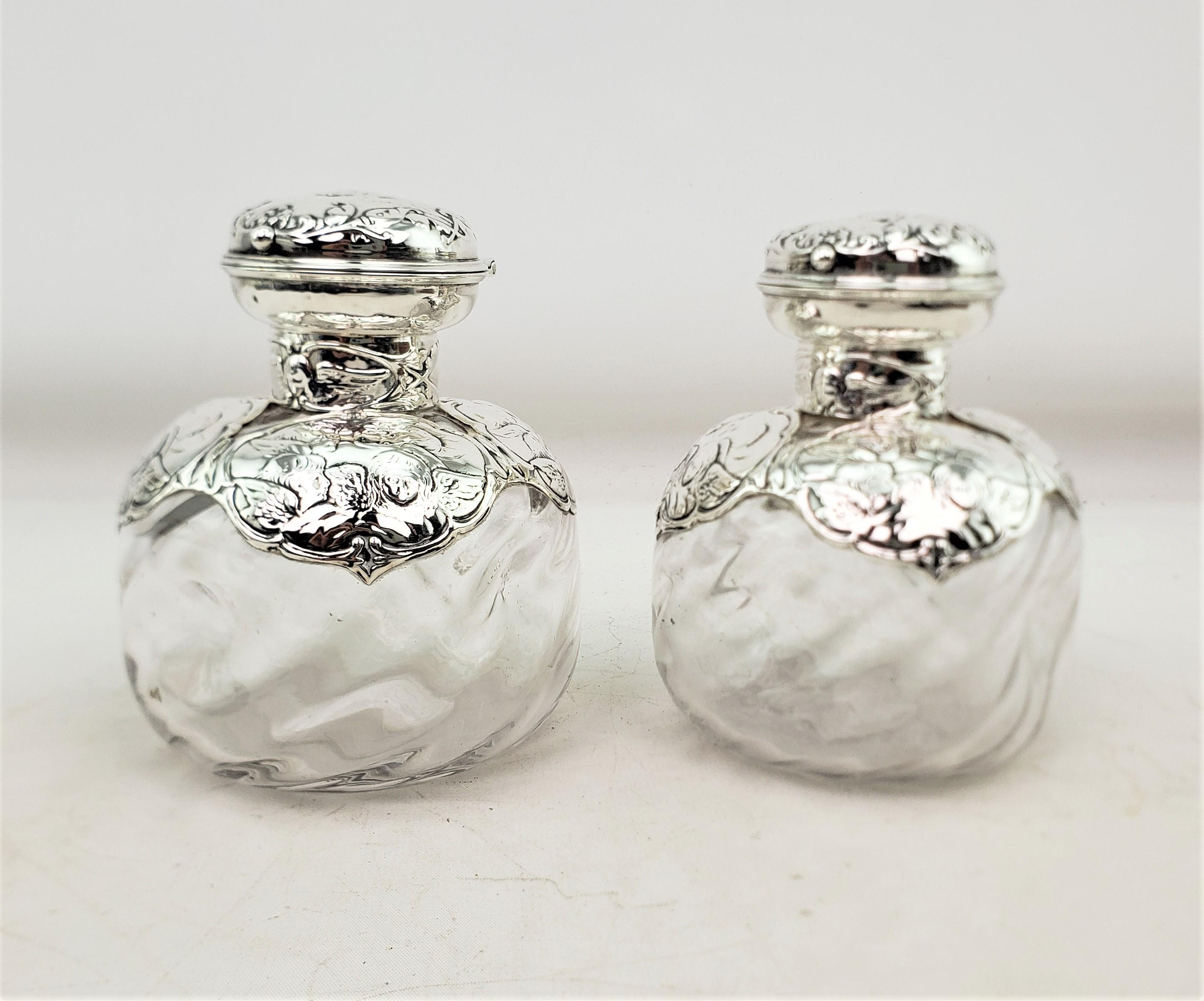 Victorian Pair of English Antique Perfume Bottles with Sterling Silver Repousse Angels For Sale