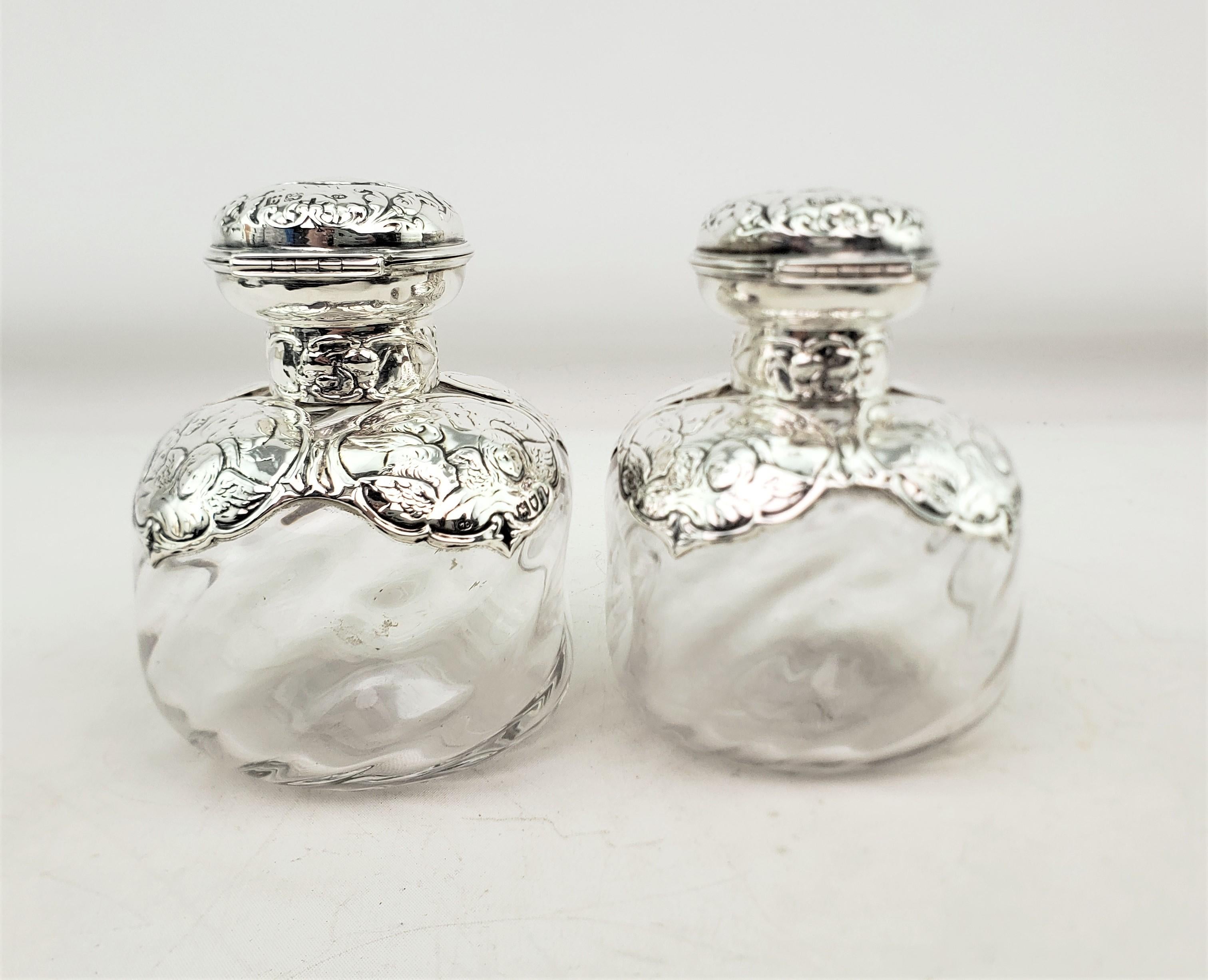 19th Century Pair of English Antique Perfume Bottles with Sterling Silver Repousse Angels For Sale