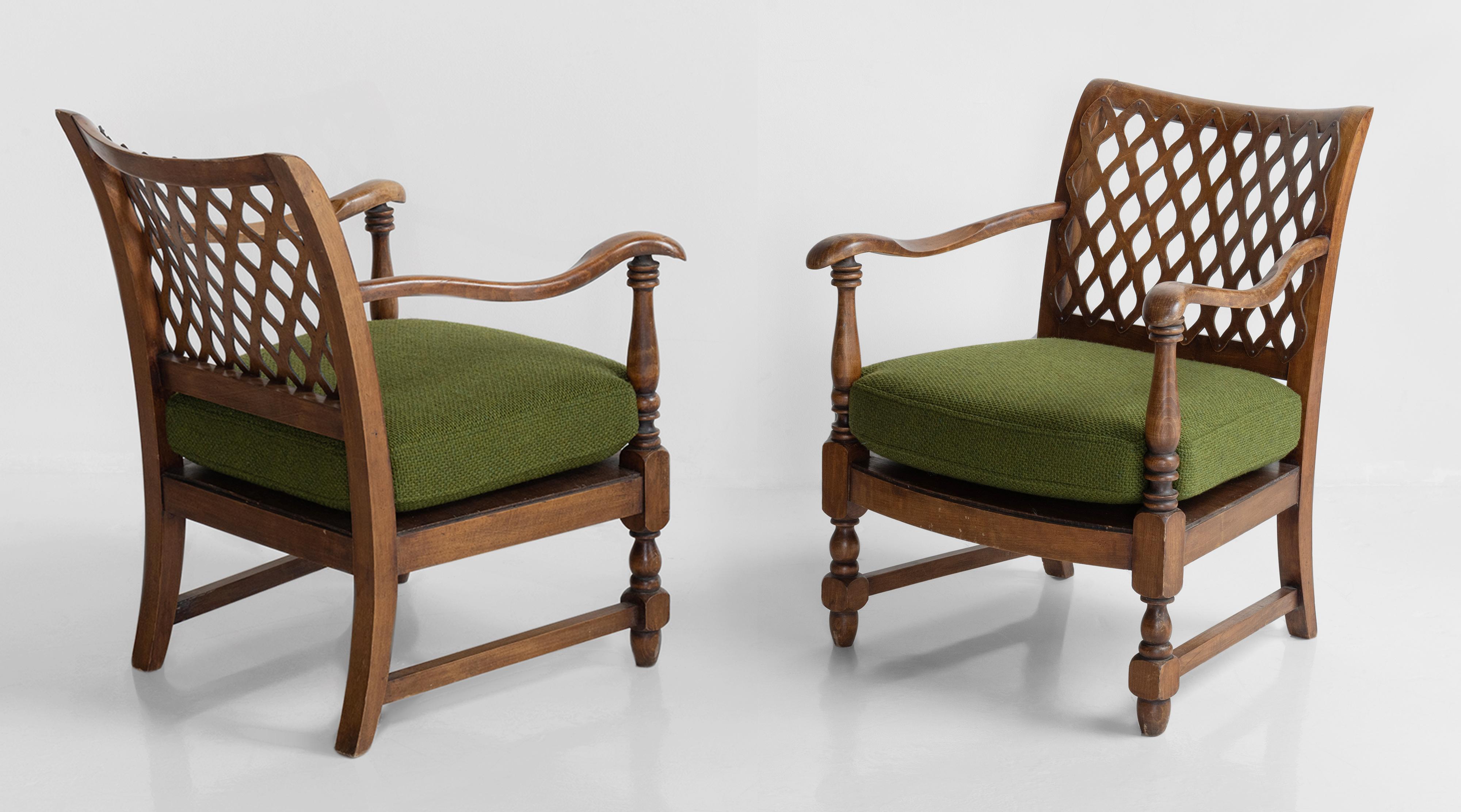 Pair of English armchairs, circa 1950.

Handsomely carved frames with lattice backs. Newly upholstered cushion in Maharam wool fabric.