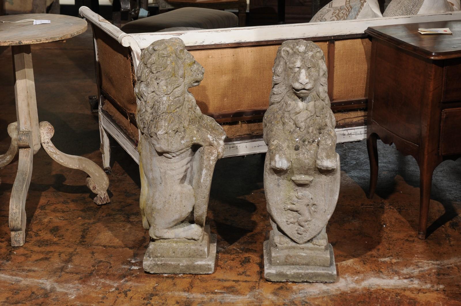 20th Century Pair of English Armorial Carved Stone Lion Sculptures with Shields, circa 1920