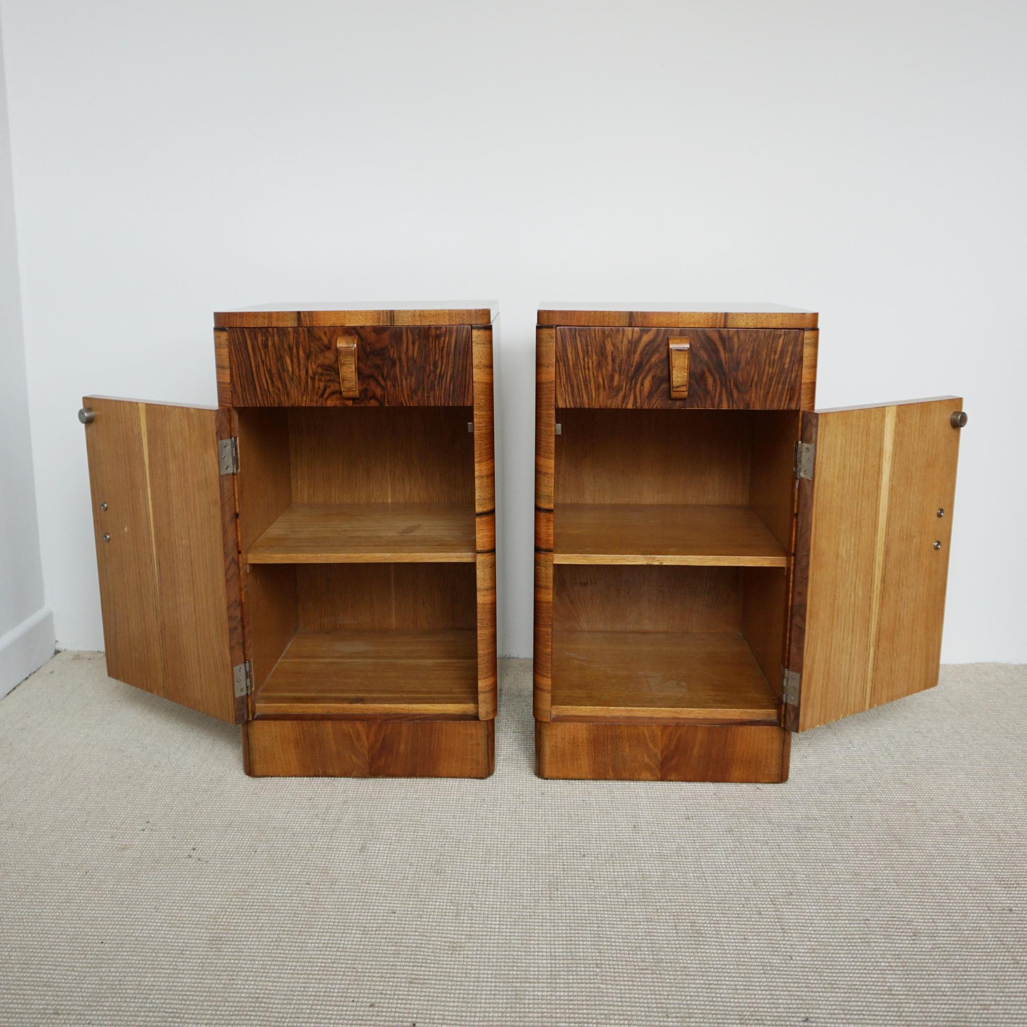 A pair of Art Deco bedside cabinets. Burr walnut veneered with figured walnut banding and original wooden handles. Drawer to top with shelved cabinet beneath.

Dimensions: H 66cm, W 39cm, D 38cm

Origin: English

Date: Circa 1930

Item No: 2003242

