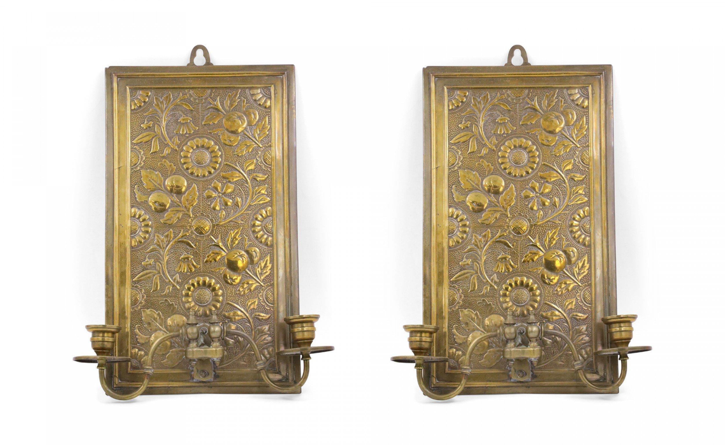 Pair of English Arts & Crafts (Aesthetic Movement) embossed brass wall sconces with two swivel scroll arms and rectangular floral design back plates (Priced as pair).
  