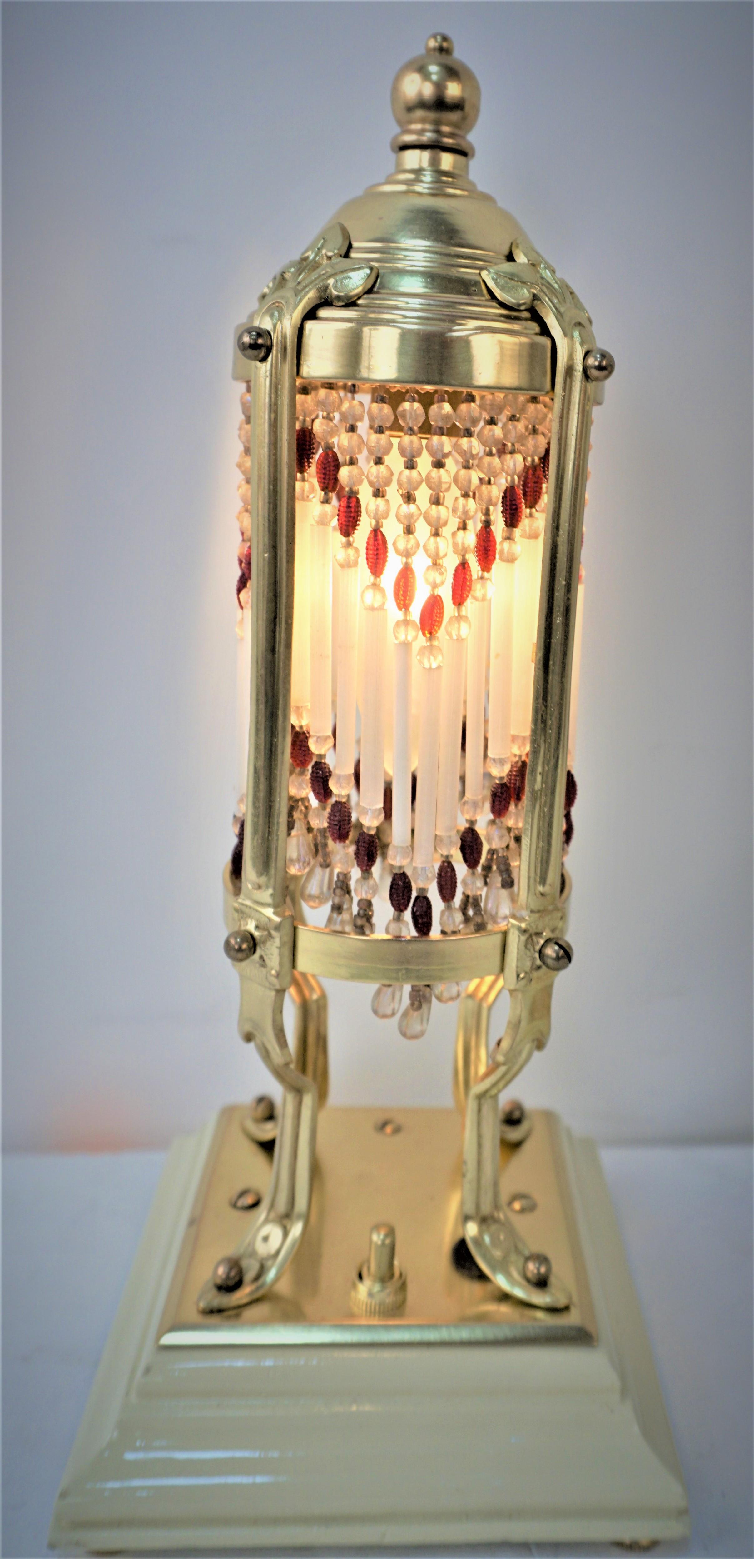 Pair of arts & crafts - art nouveau brass beaded glass with lacquer wood base
table lamps.