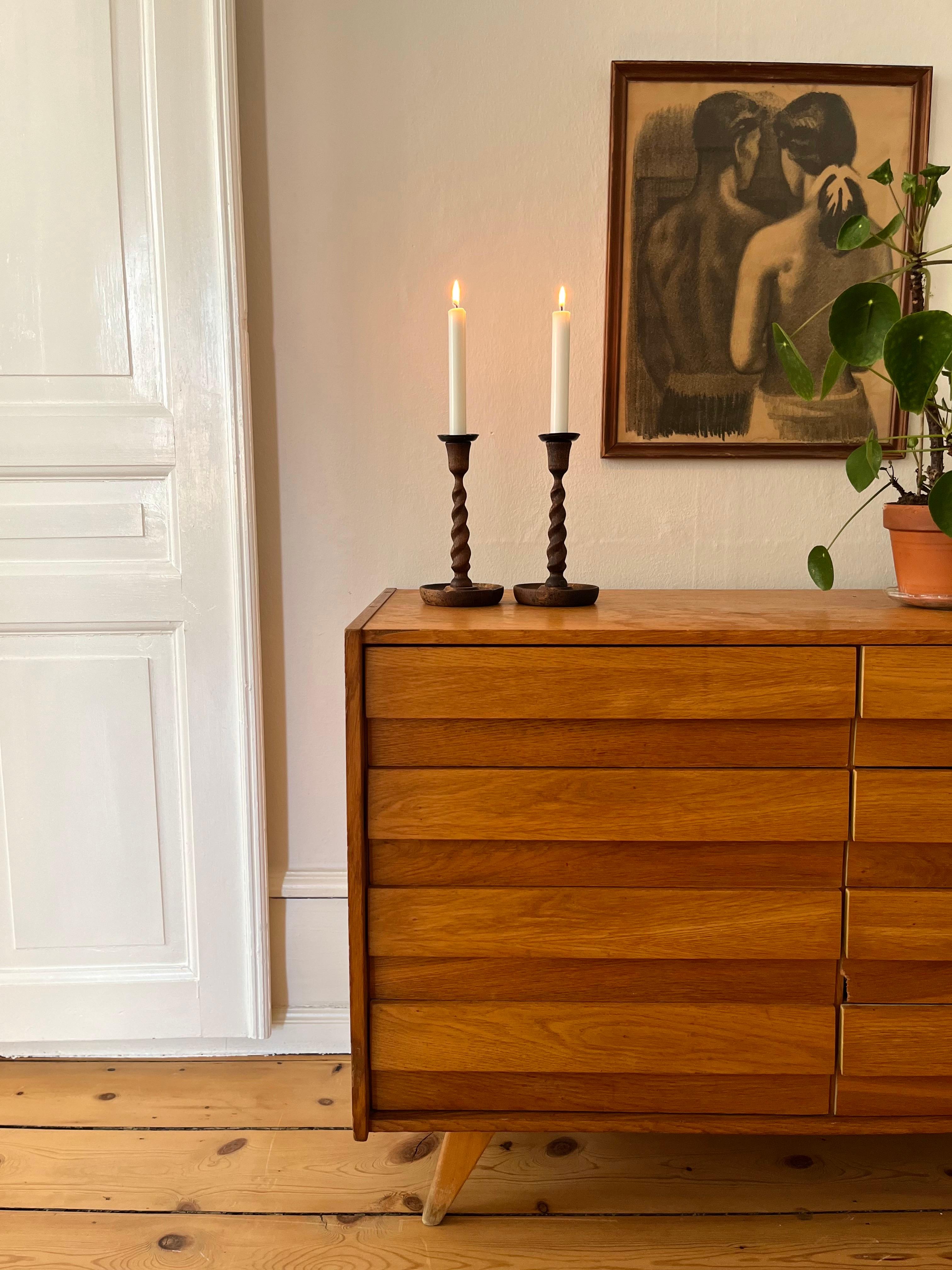 Pair of English Barley Twist Wooden Candlesticks, 1920s

Beautiful pair of English candlesticks from the 1920s, handcrafted in the iconic barley twist style. This timeless design — inspired by 17th century European furniture detailing — features
