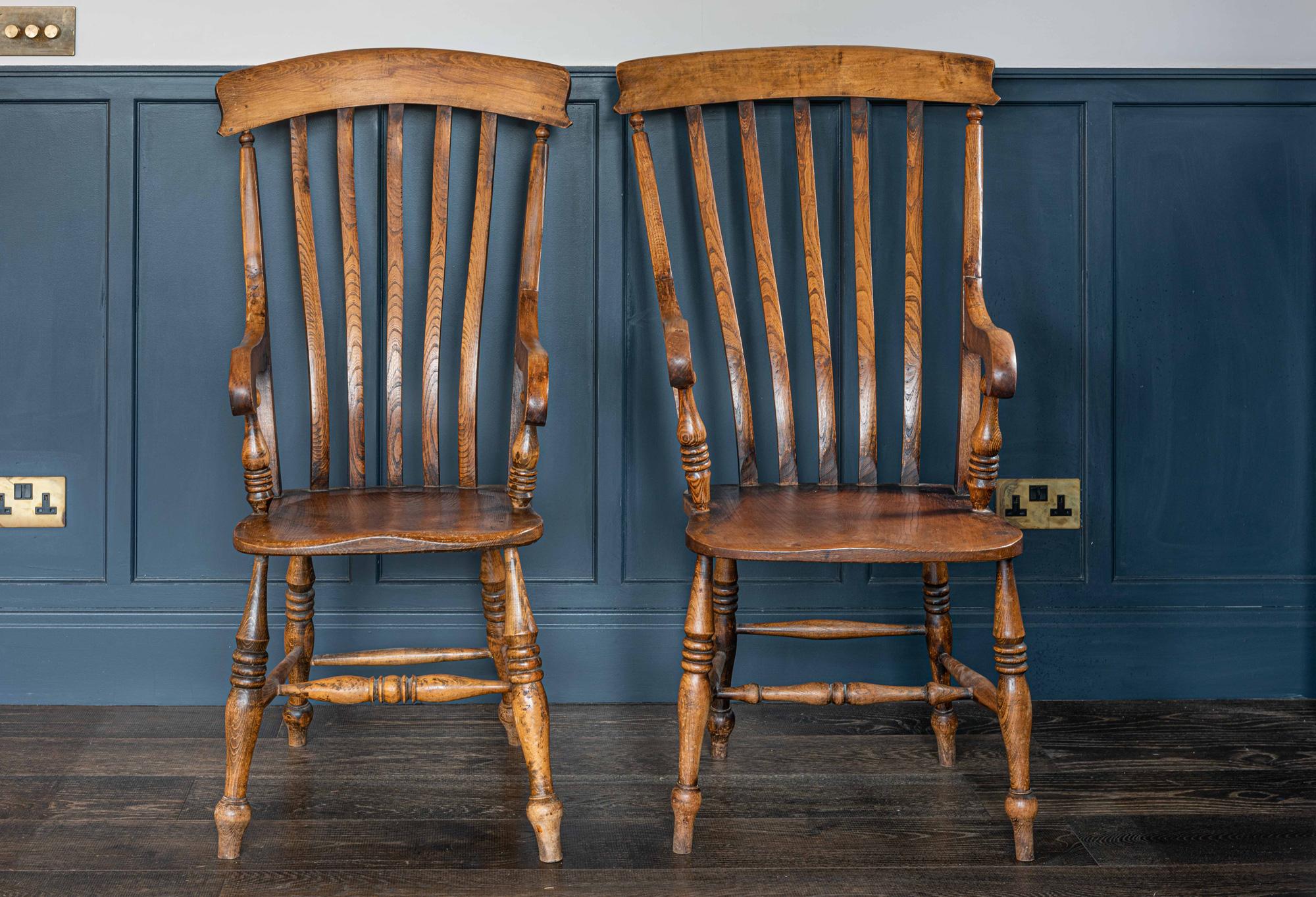 Pair of English beech and elm slat back windsor carver chairs, late 19th century
Near pair of his and hers (slightly different proportions & design) good original wear and rich color. Signs of historical repairs.

Price is for the