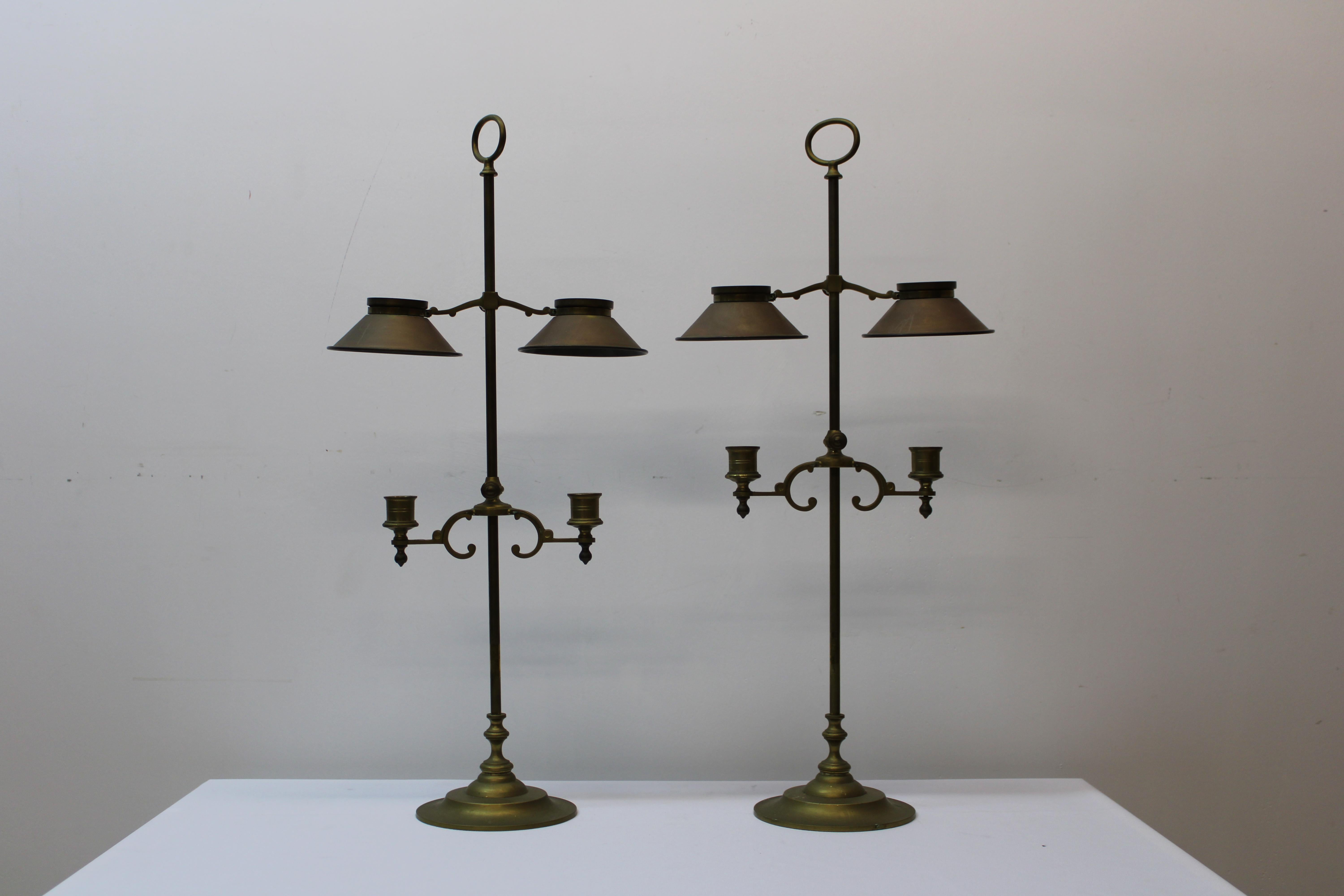C. 20th century

Pair of English brass adjustable candle holders w/covers.