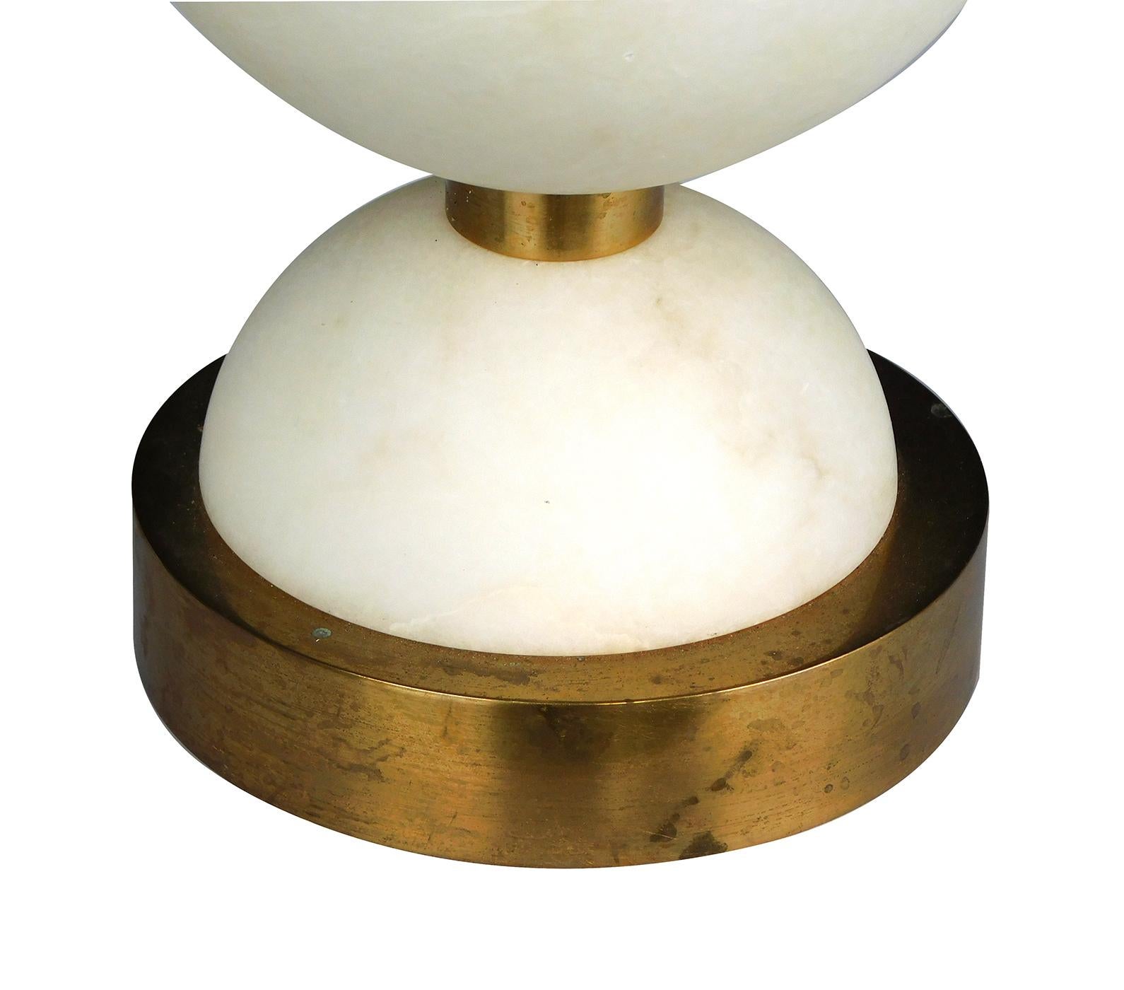 Each modeled as stacked half-spheres on a brass circular base.