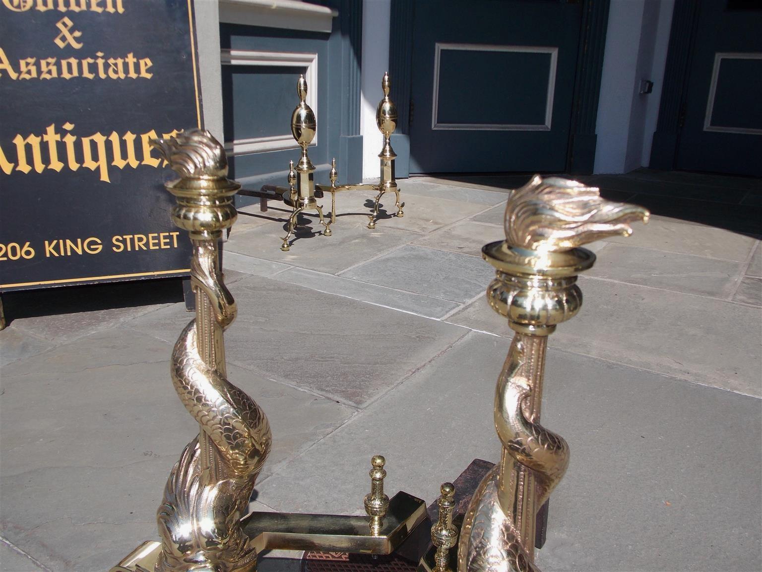 Pair of English Brass Intertwined Dolphin Andirons with Flame Finials. C. 1830 In Excellent Condition For Sale In Hollywood, SC