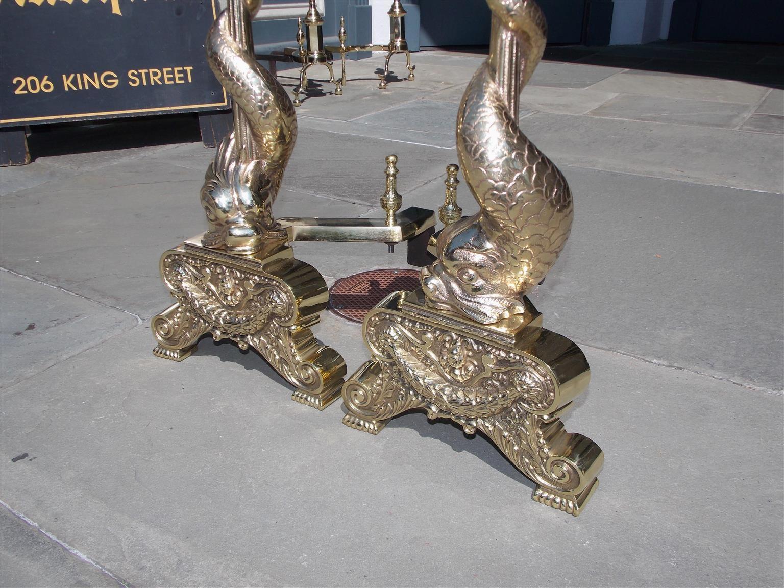 Mid-19th Century Pair of English Brass Intertwined Dolphin Andirons with Flame Finials. C. 1830 For Sale