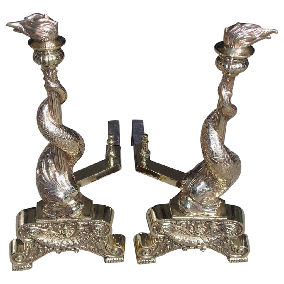 Pair of English Brass Intertwined Dolphin Andirons with Flame Finials. C. 1830 For Sale