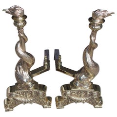 Pair of English Brass Intertwined Dolphin Andirons with Flame Finials. C. 1830
