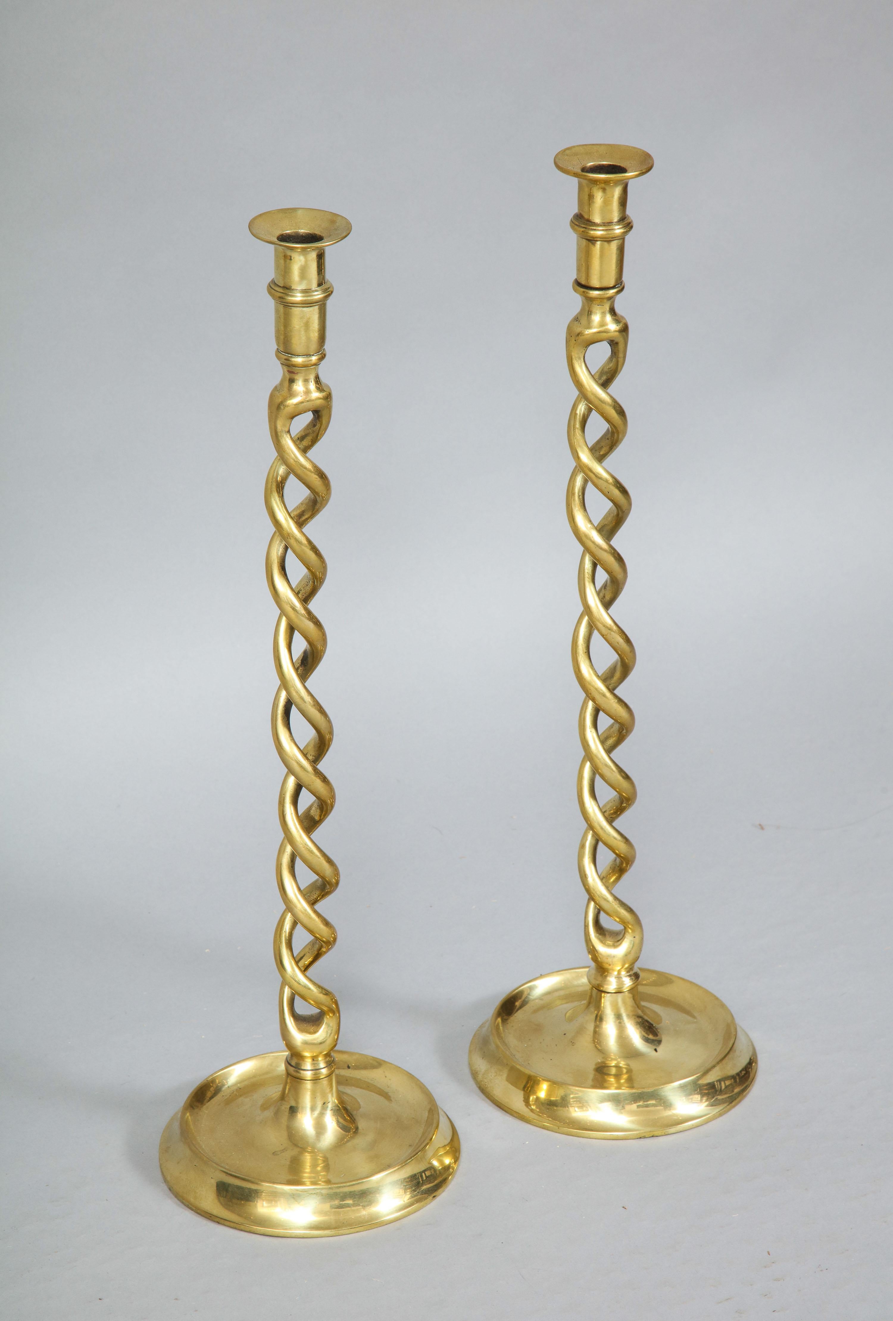 Fine pair of over scale Edwardian English brass candlesticks with barley twist design.