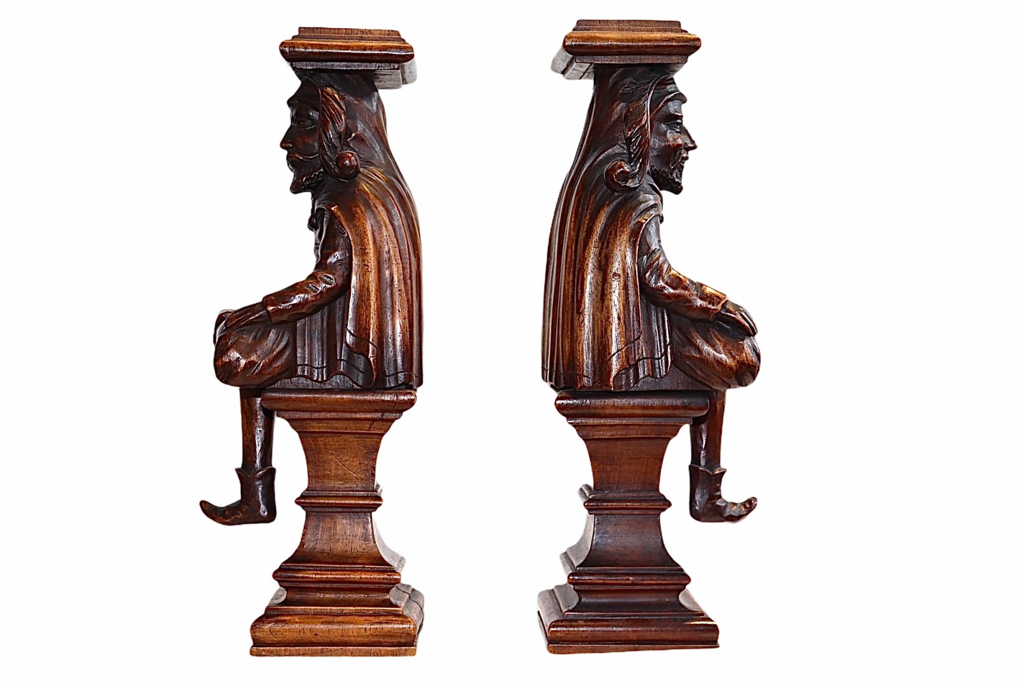 A very fine pair of 18th century carved figures, of Court Jesters These bearded gentlemen have been superbly carved in the finest detail, they original came from a piece of early 18th Century Furniture. Both the characters have finely detailed
