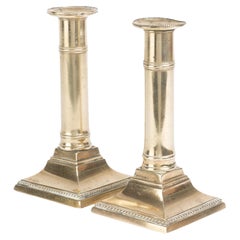 Pair of English Cast Brass Columnar Candle Sticks on a Square Base, 1810